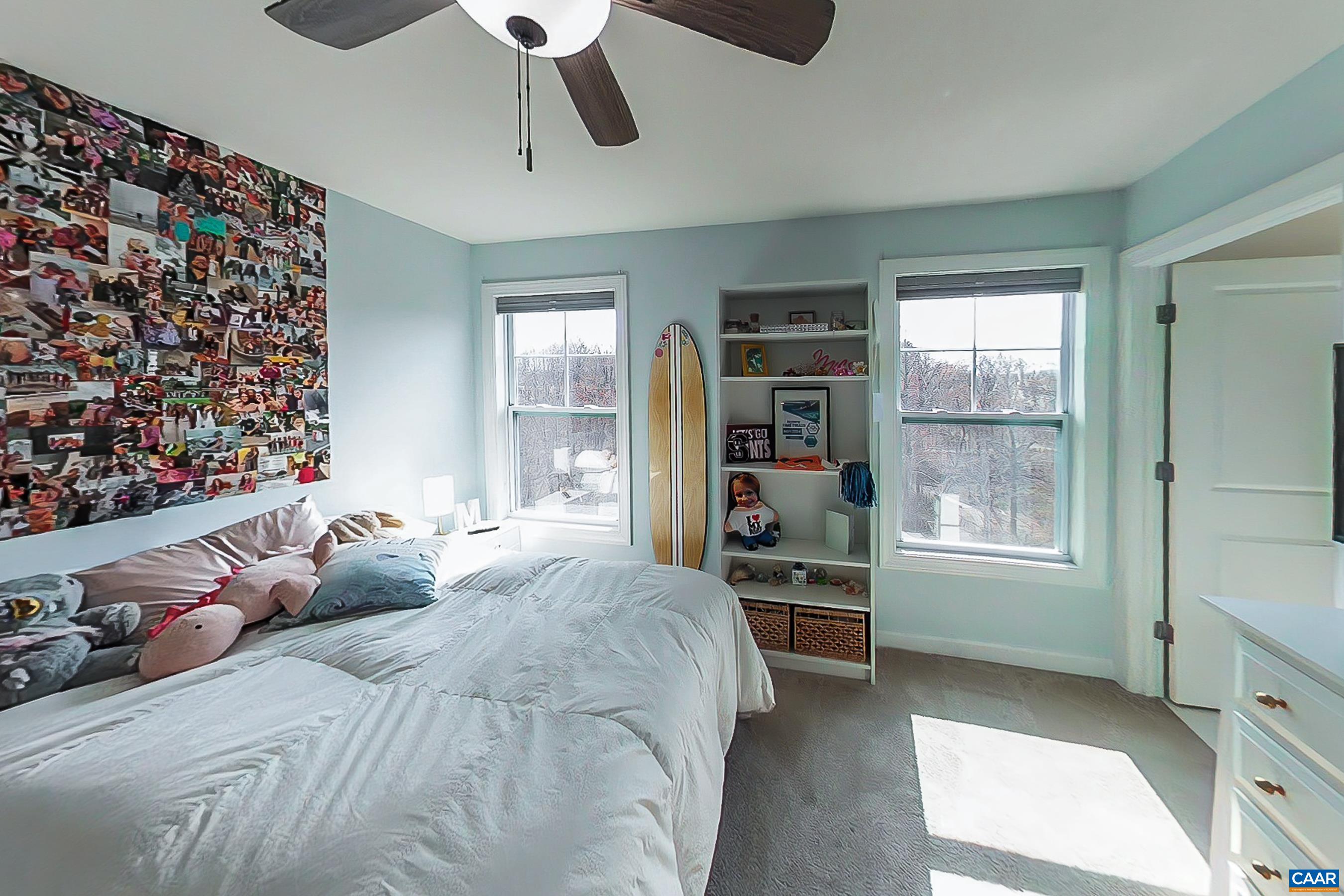 Guest bedroom with walk in closet and ensuite bathroom.