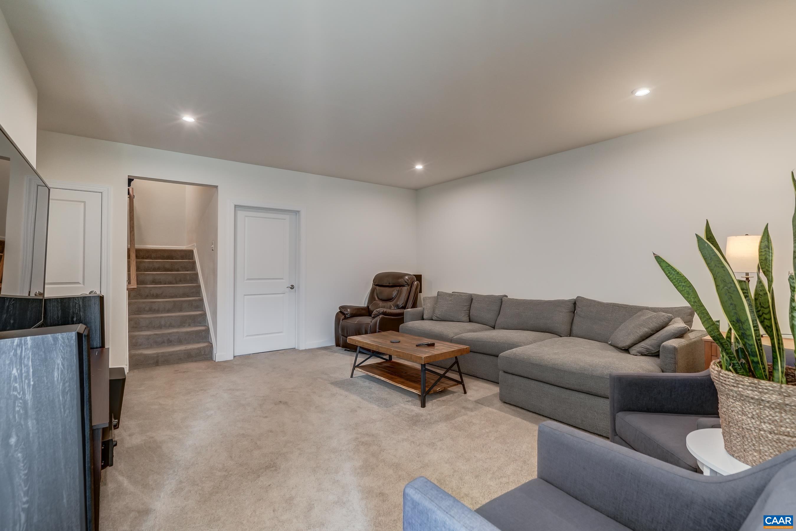 Walk out basement features a large rec room with game area