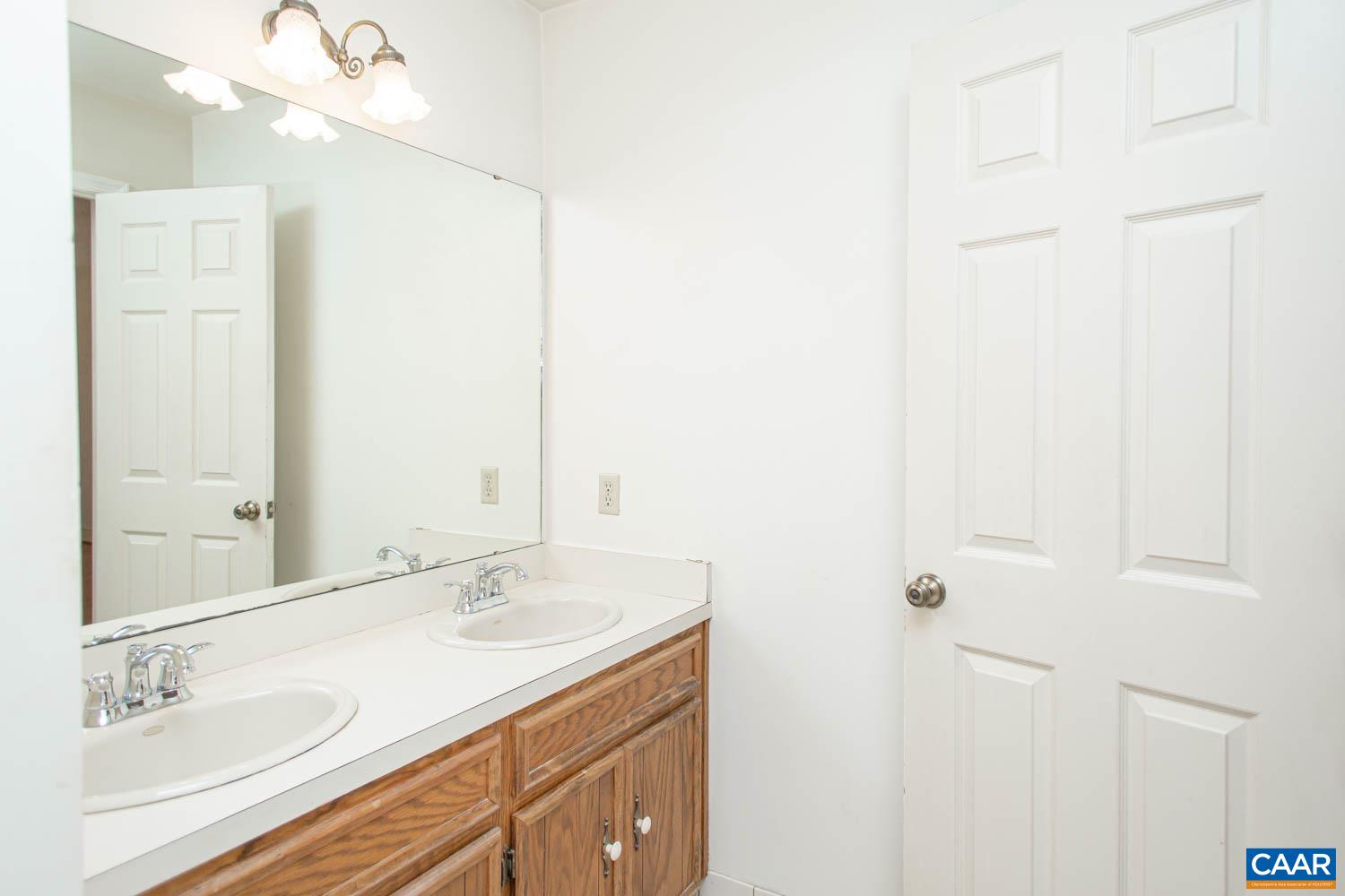 Attached bath with dual sinks.