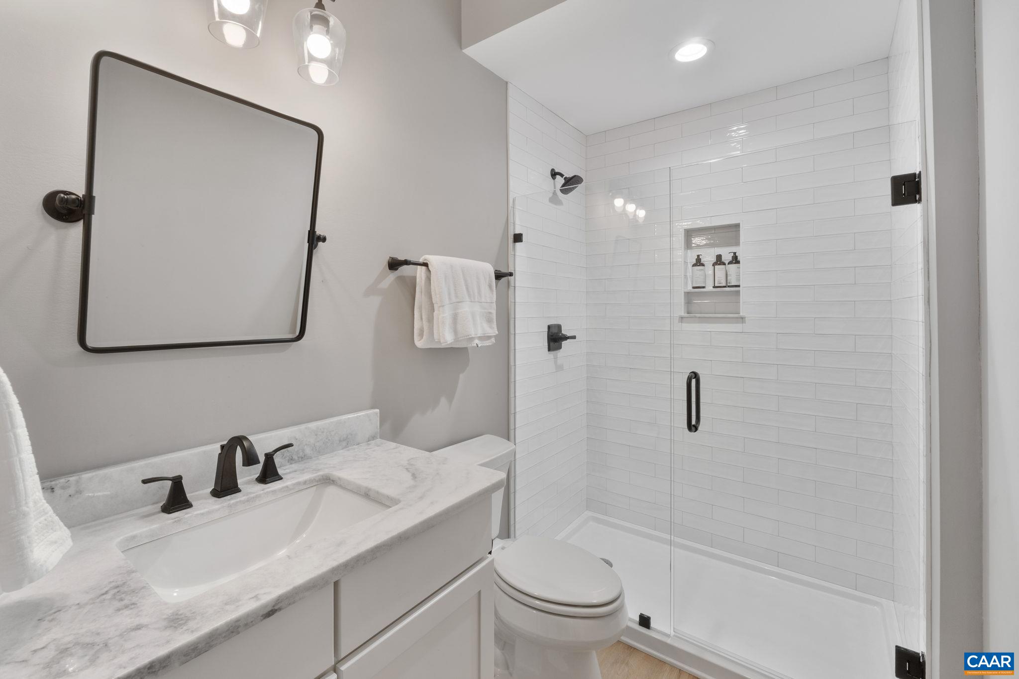 Full bathroom attached to basement bedroom makes it perfect for guests or an in-law suite.