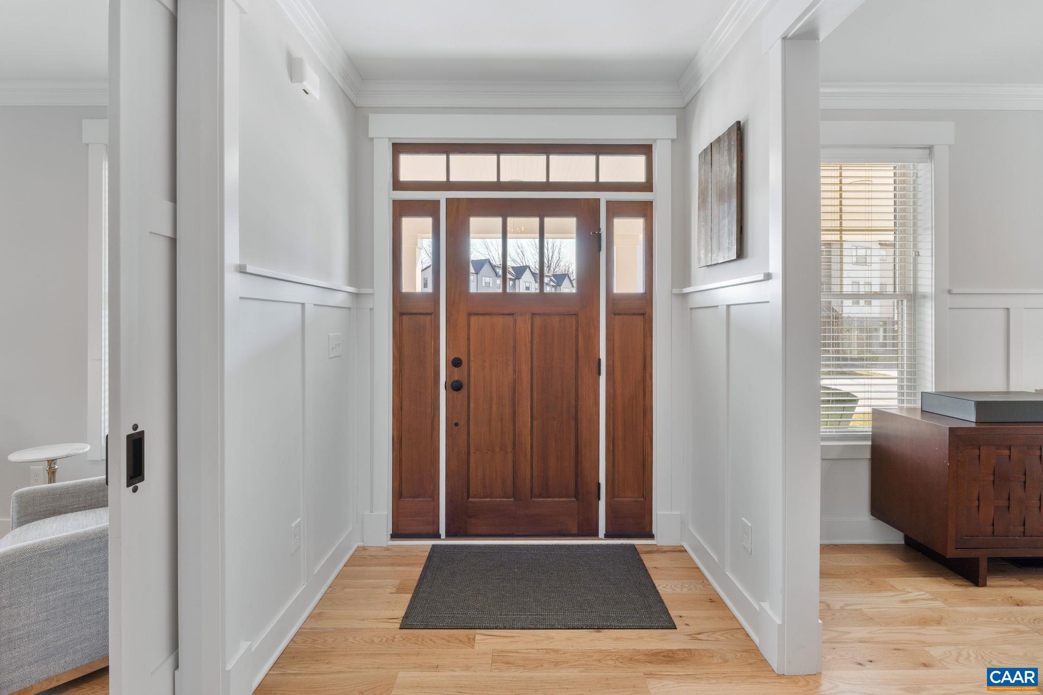 Featuring batten board grid trim that continues throughout the home