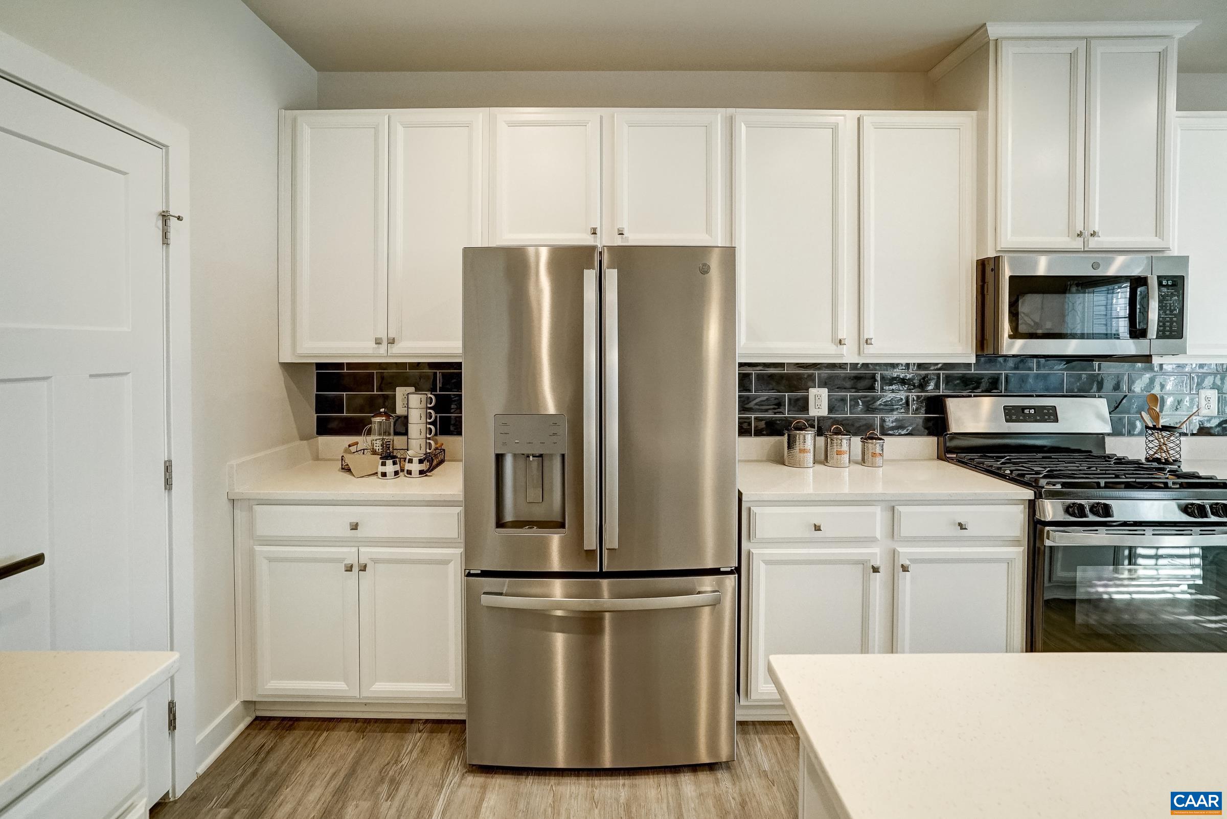 Stainless steel appliances sparkle in this kitchen. Stainless steel appliances sparkle in this kitchen.