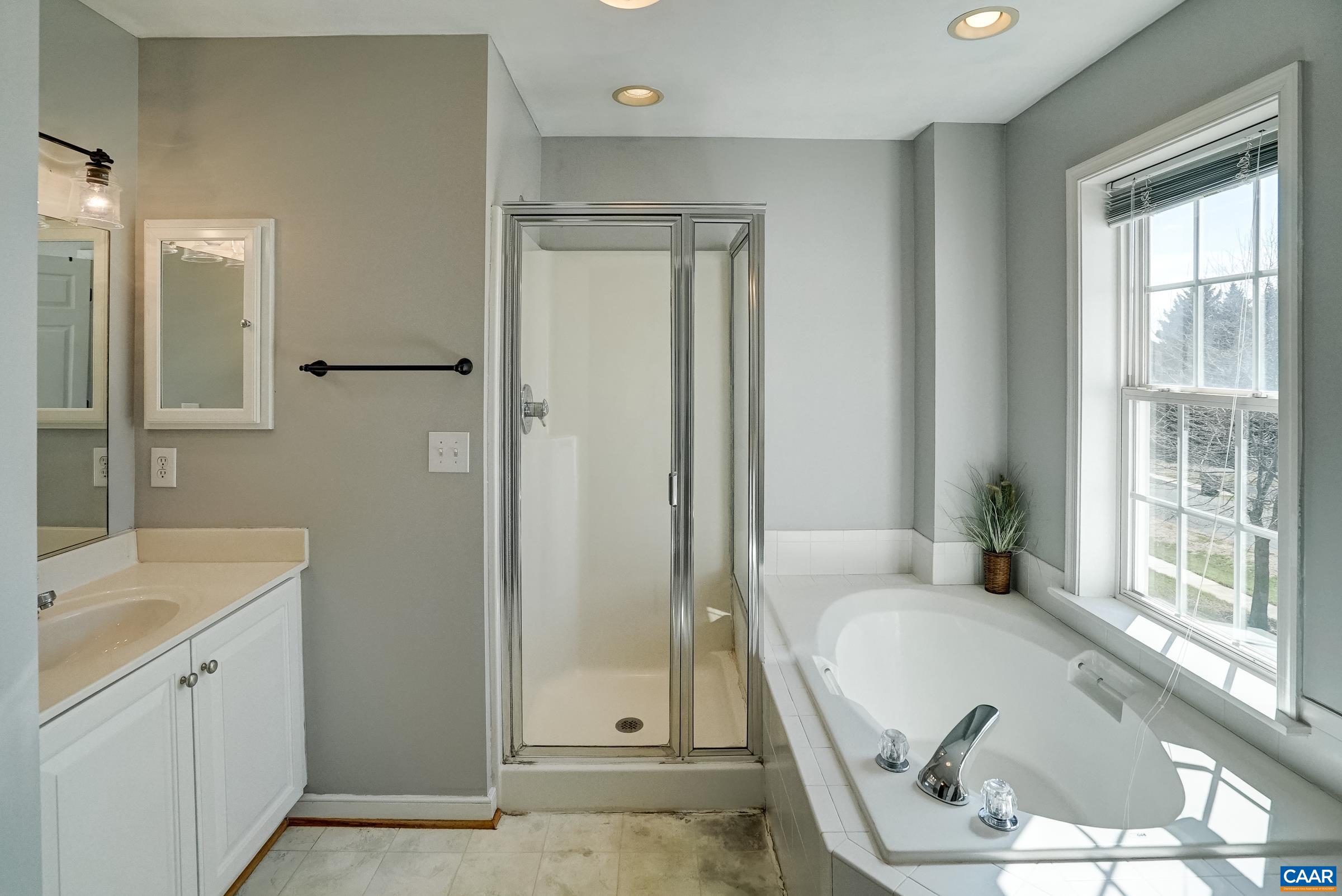 Primary bath with garden tub, two vanities and separate shower. Primary bath with garden tub, two vanities and separate shower.