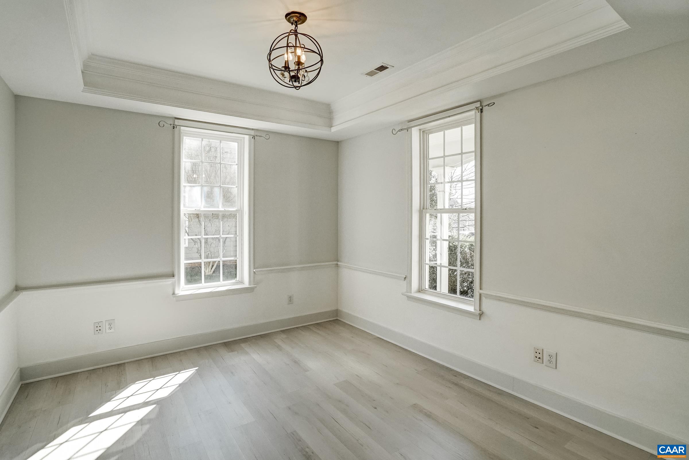 Dining room features wainscotting, new light fixture and butlers pantry. Dining room features wainscotting, new light fixture and butlers pantry.