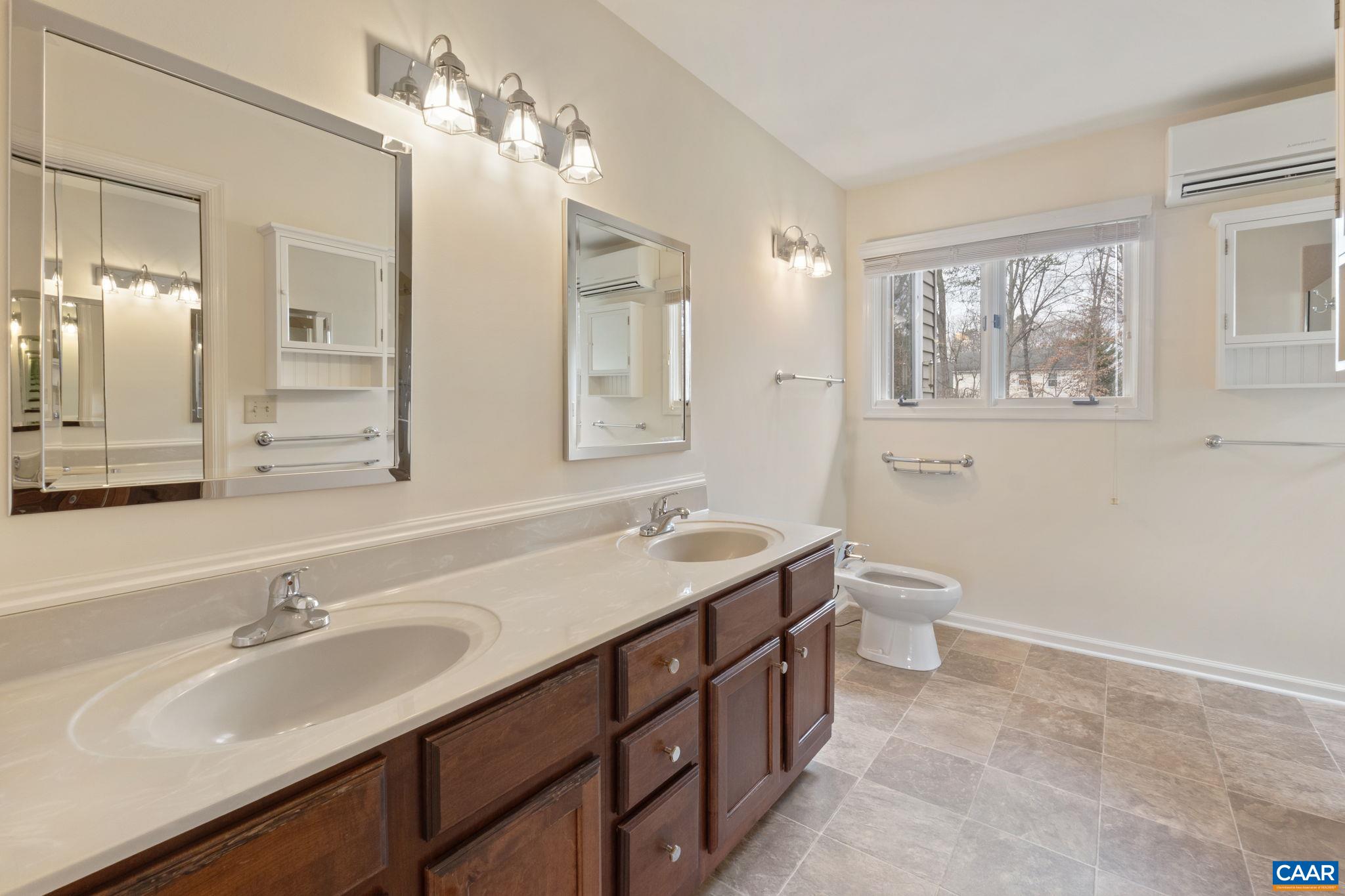 Dedicated mini split in primary bath offers precise regulation of temperature for owner's comfort