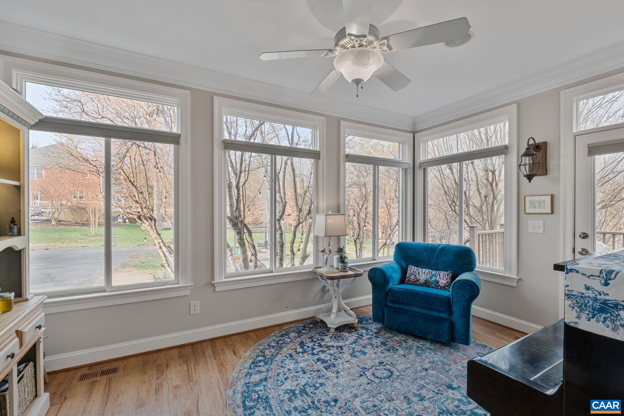 Sunroom opens out to deck and rear yard