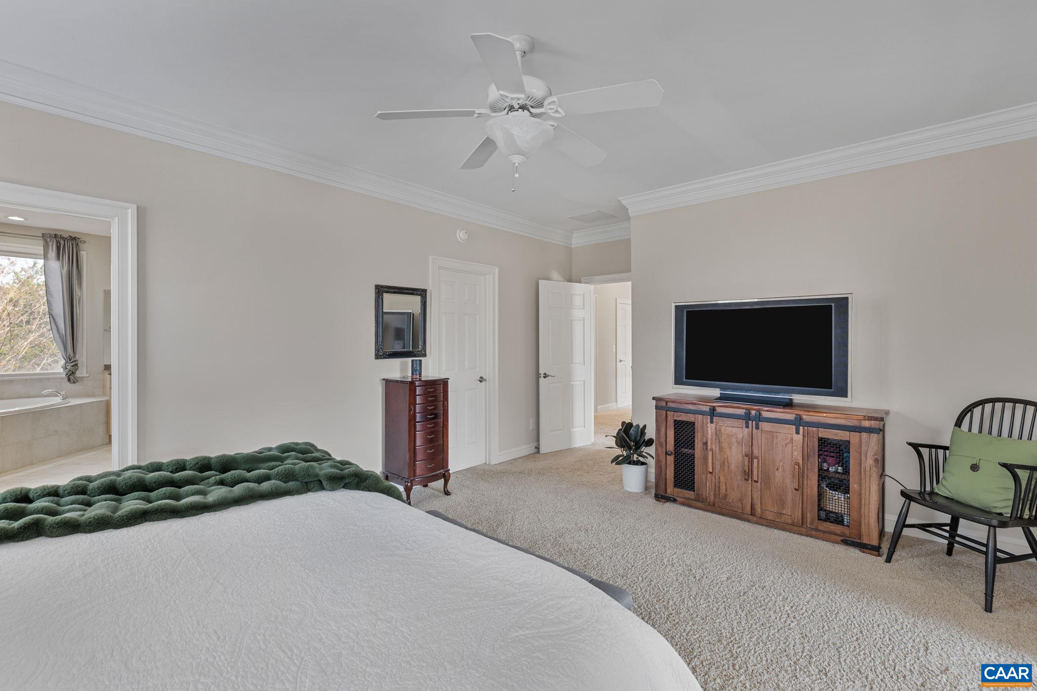 Primary suite has a generously sized walk in closet with access to both bedroom and bathroom