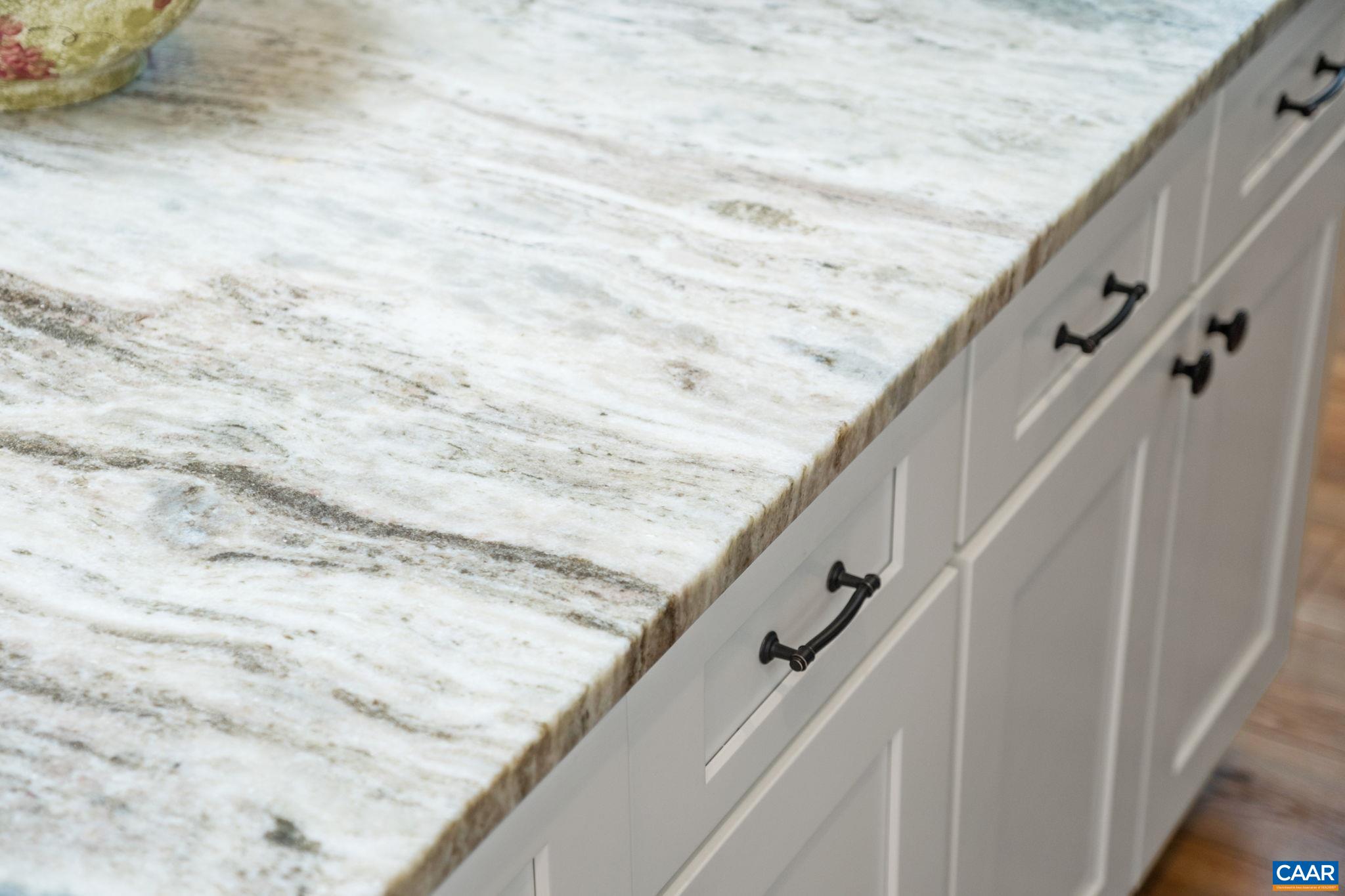 The countertops are an upgraded leathered granite. The countertops are an upgraded leathered granite.