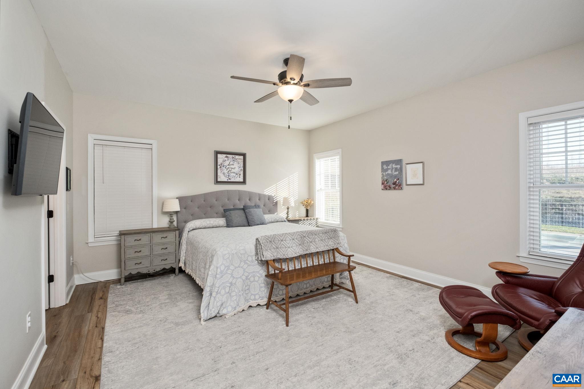 The primary suite features a large primary bedroom, walk-in closet, and a primary bathroom with a glass-enclosed tiled shower, water closet, linen closet, and dual vanities. The primary suite features a large primary bedroom, walk-in closet, and a primary bathroom with a glass-enclosed tiled shower, water closet, linen closet, and dual vanities.