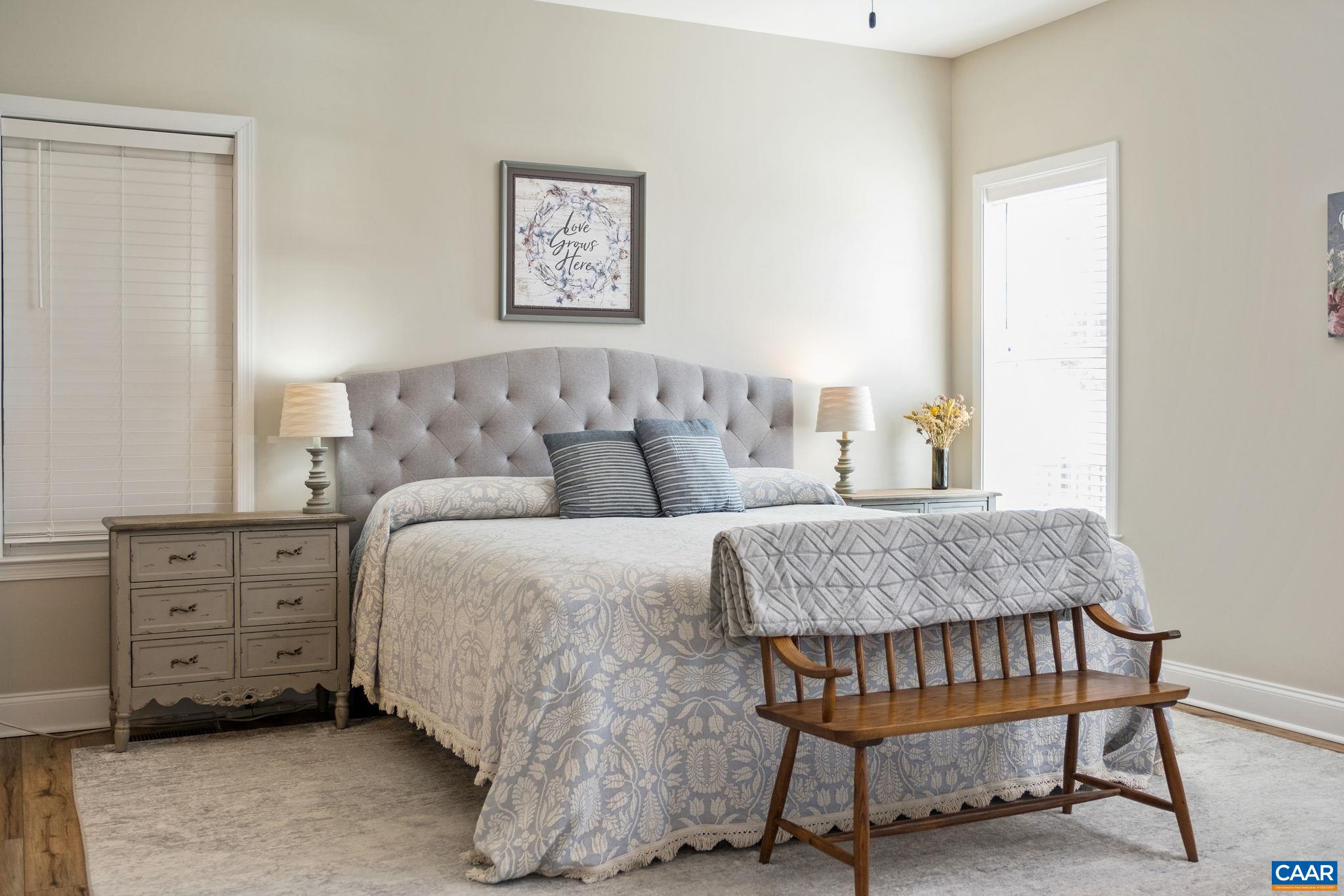 The primary suite features a large primary bedroom, walk-in closet, and a primary bathroom with a glass-enclosed tiled shower, water closet, linen closet, and dual vanities. The primary suite features a large primary bedroom, walk-in closet, and a primary bathroom with a glass-enclosed tiled shower, water closet, linen closet, and dual vanities.