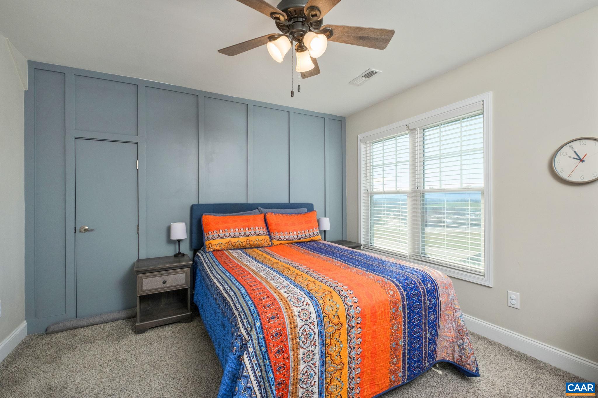Bedroom #2 features a custom board and batten accent wall, and mountain views. This bedroom also has storage space. The storage area is walk-in. Bedroom #2 features a custom board and batten accent wall, and mountain views. This bedroom also has storage space. The storage area is walk-in.