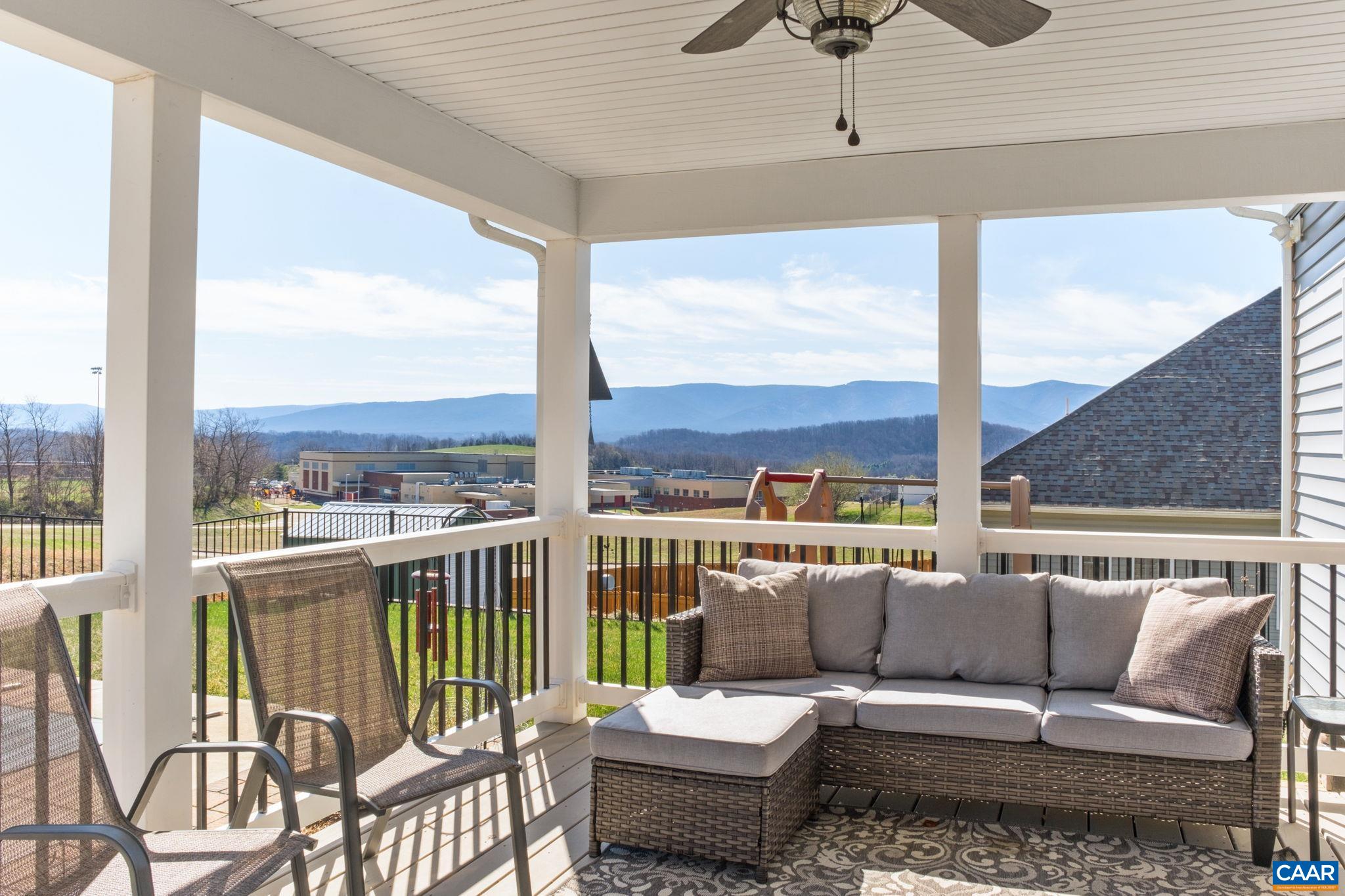 Enjoy beautiful views from the covered porch. The covered porch includes a TV mount. Enjoy beautiful views from the covered porch. The covered porch includes a TV mount.