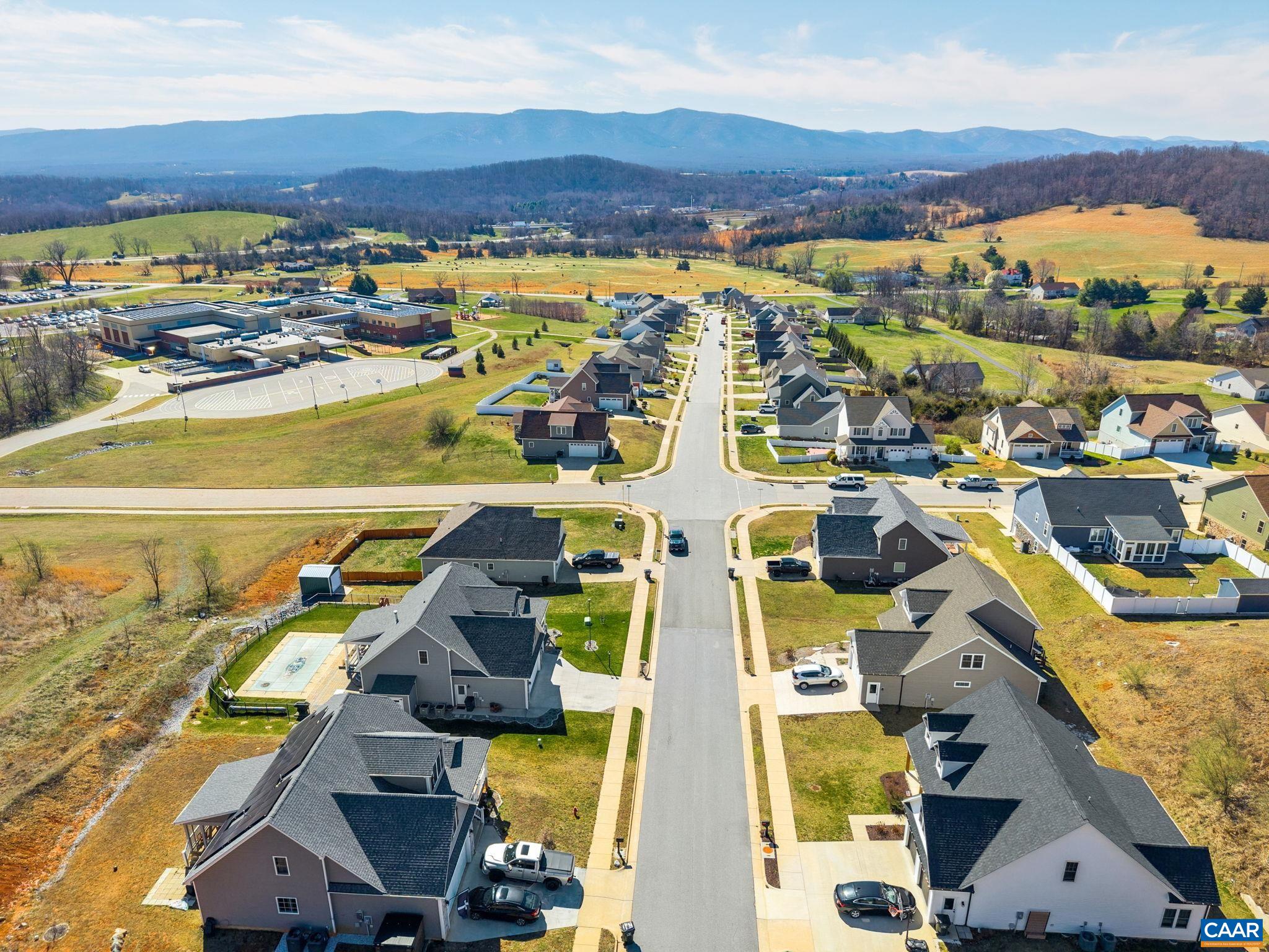 Drone view from the cul-de-sac with mountains. Drone view from the cul-de-sac with mountains.
