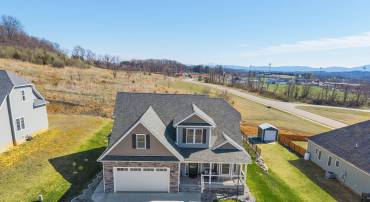 Green grass in the winter!  The yard started as sod and has been well maintained for green grass year-round.  A retaining wall was added to level off the backyard, and French drains and swells were added for peace of mind.