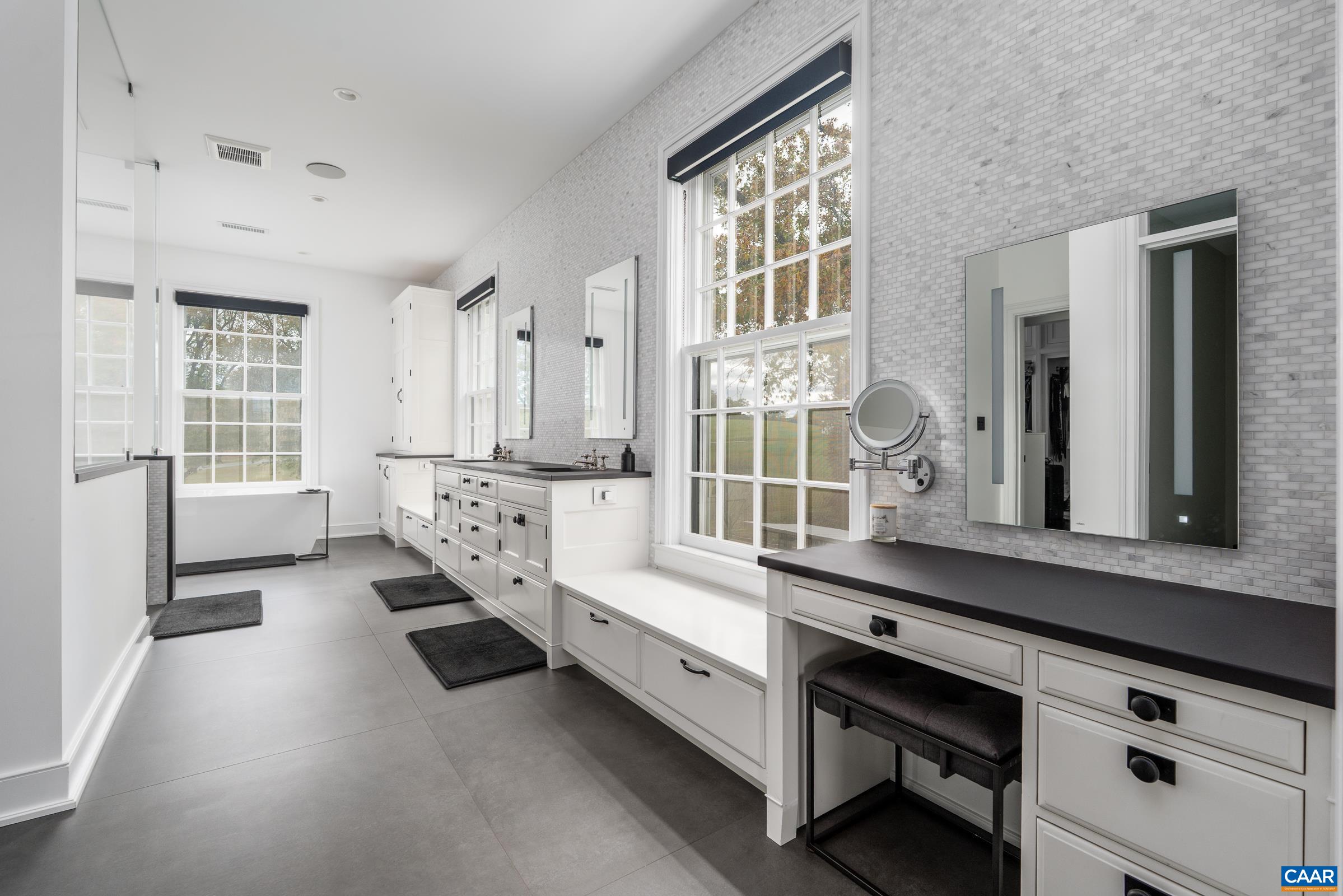 With a soaking tub, Dekton counters and walk-in shower.
