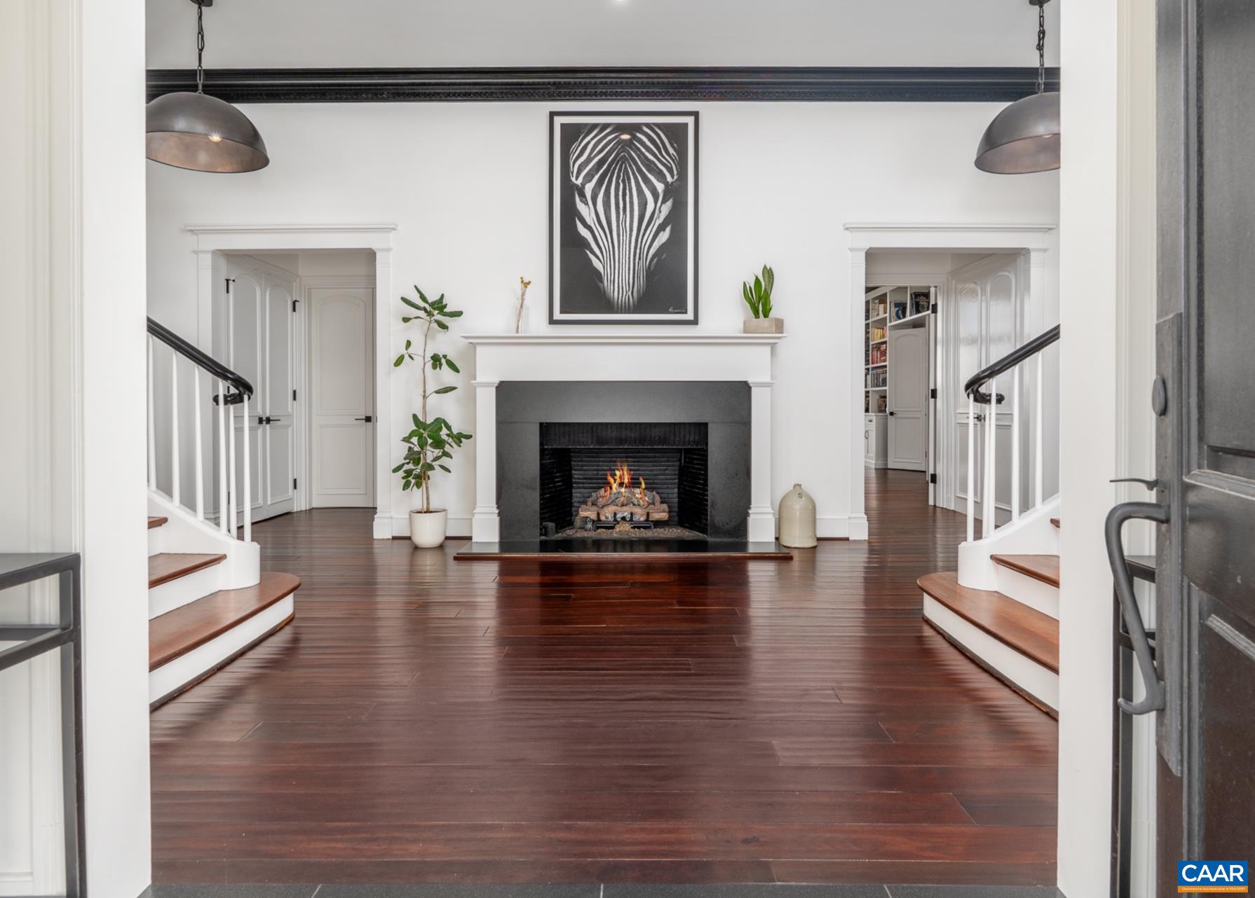 Such an amazing entry to a grand home. One of seven fireplaces within the manor.