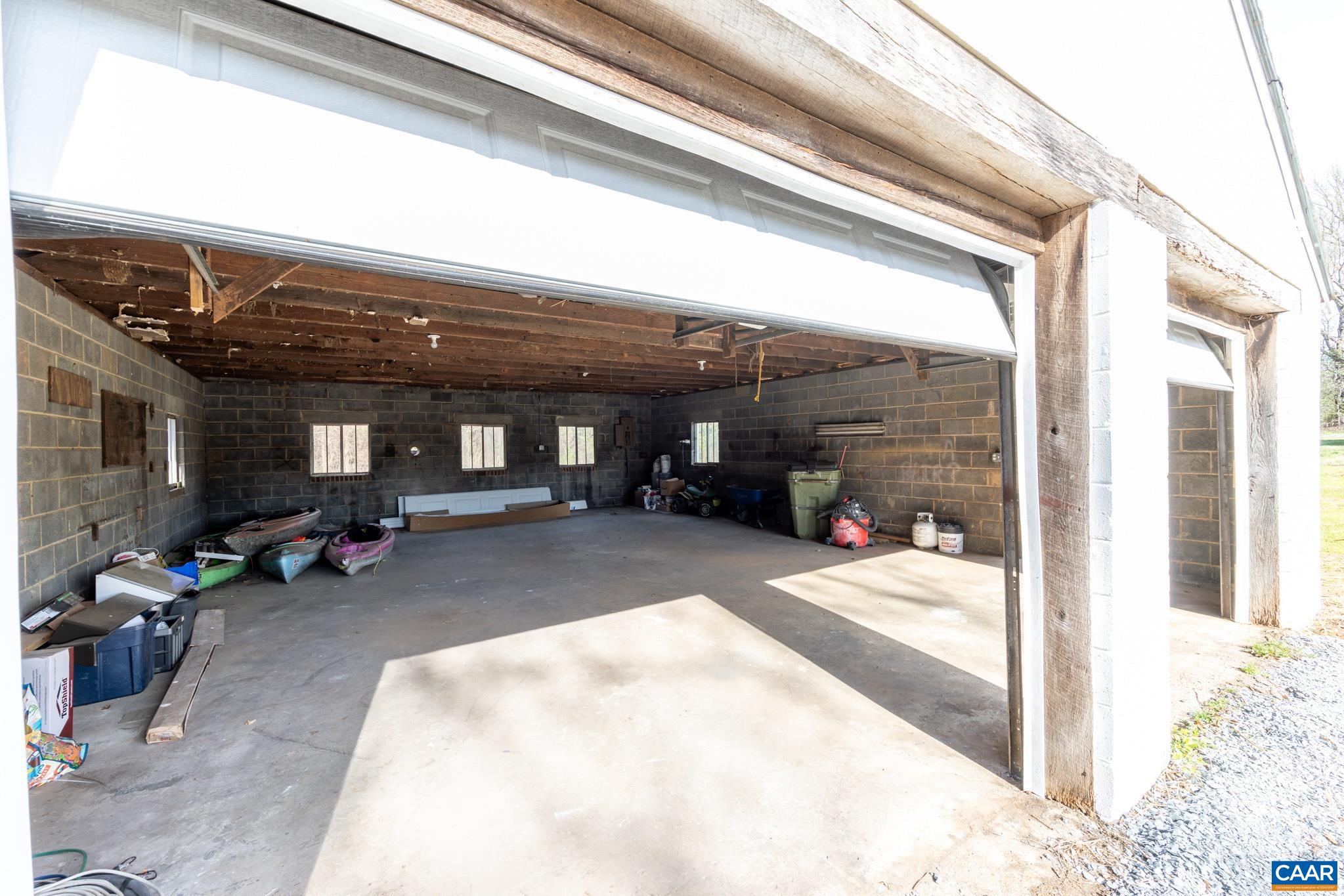 This 2 1/2 car garage can easily house four vehicles and still boasts plenty of space as a workshop.