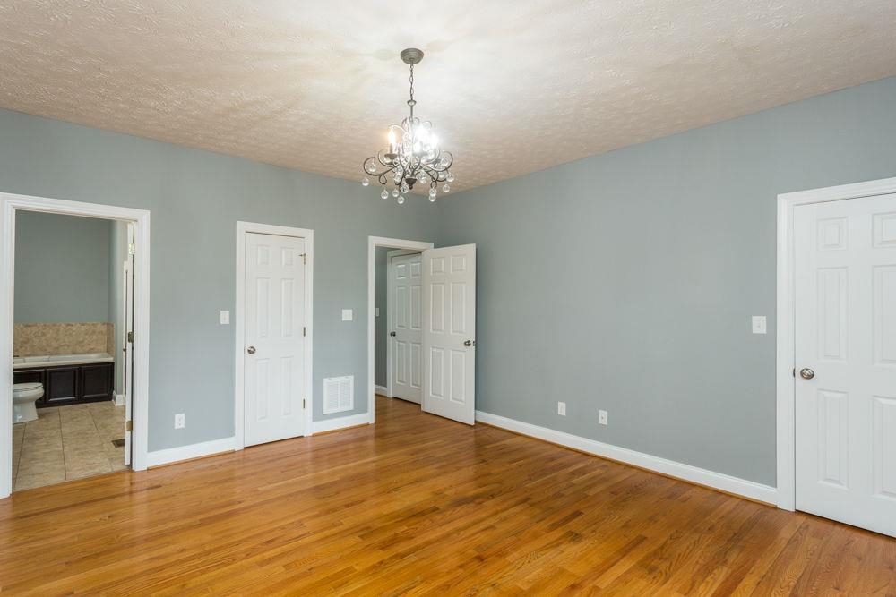 Hardwood flooring. 2 closets. Plenty of space for your king size bed.