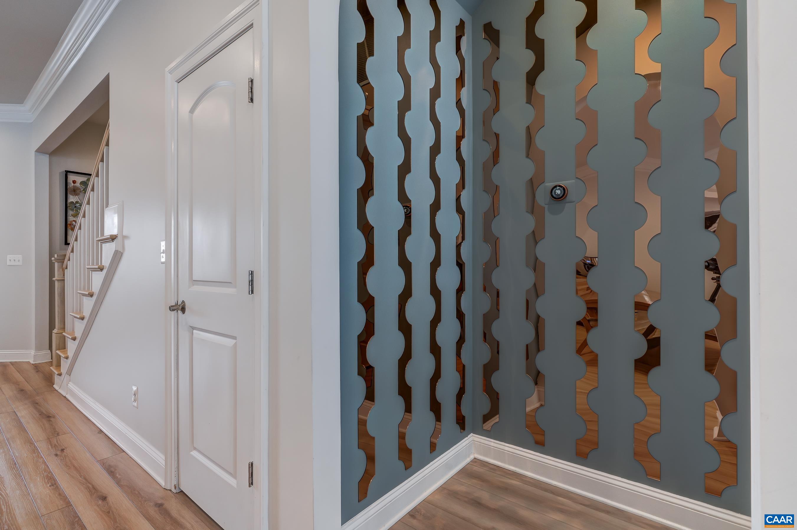Unique wall treatment in entry to primary suite.