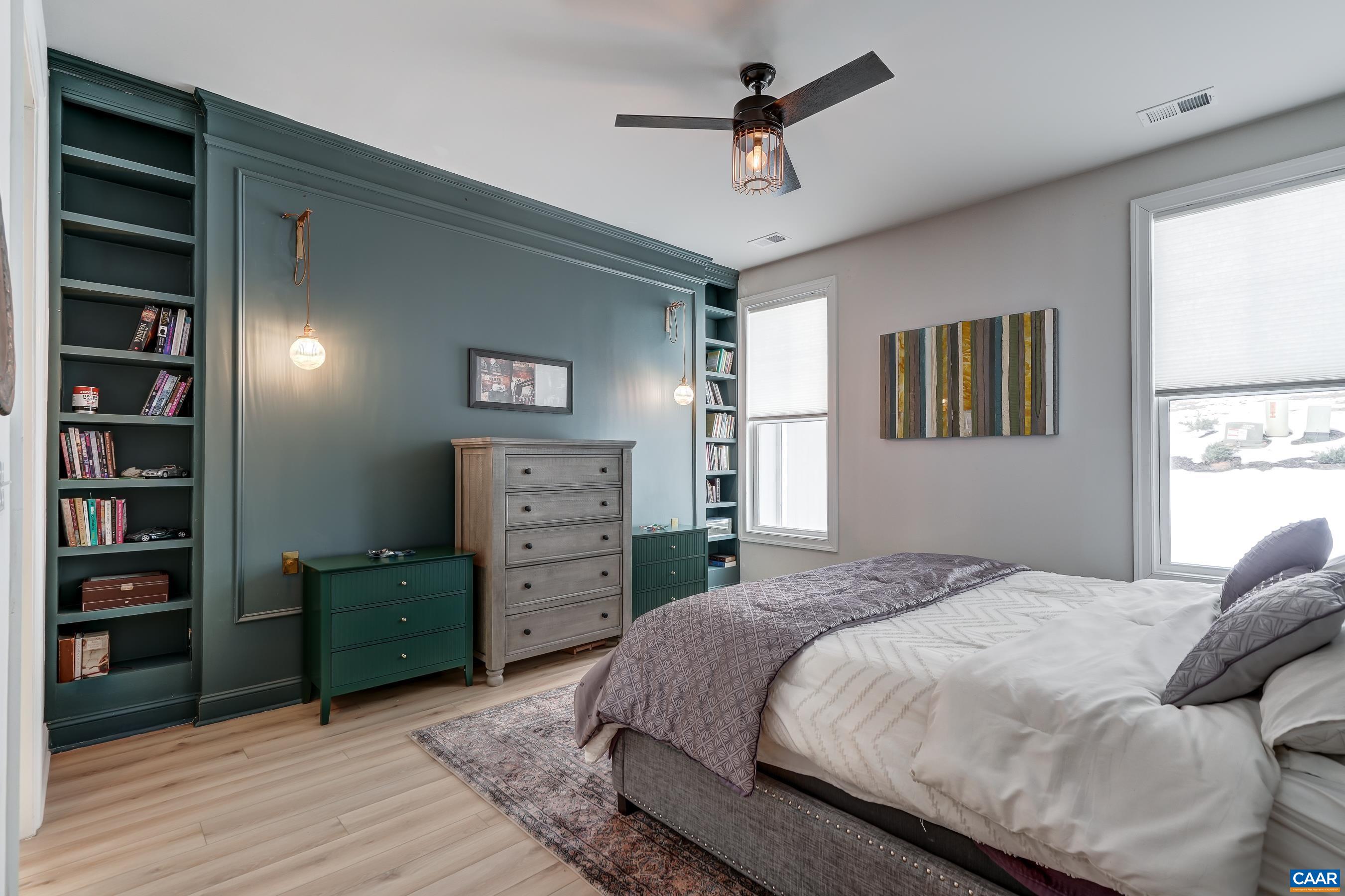Stunning accent wall with built-ins and modern lighting.