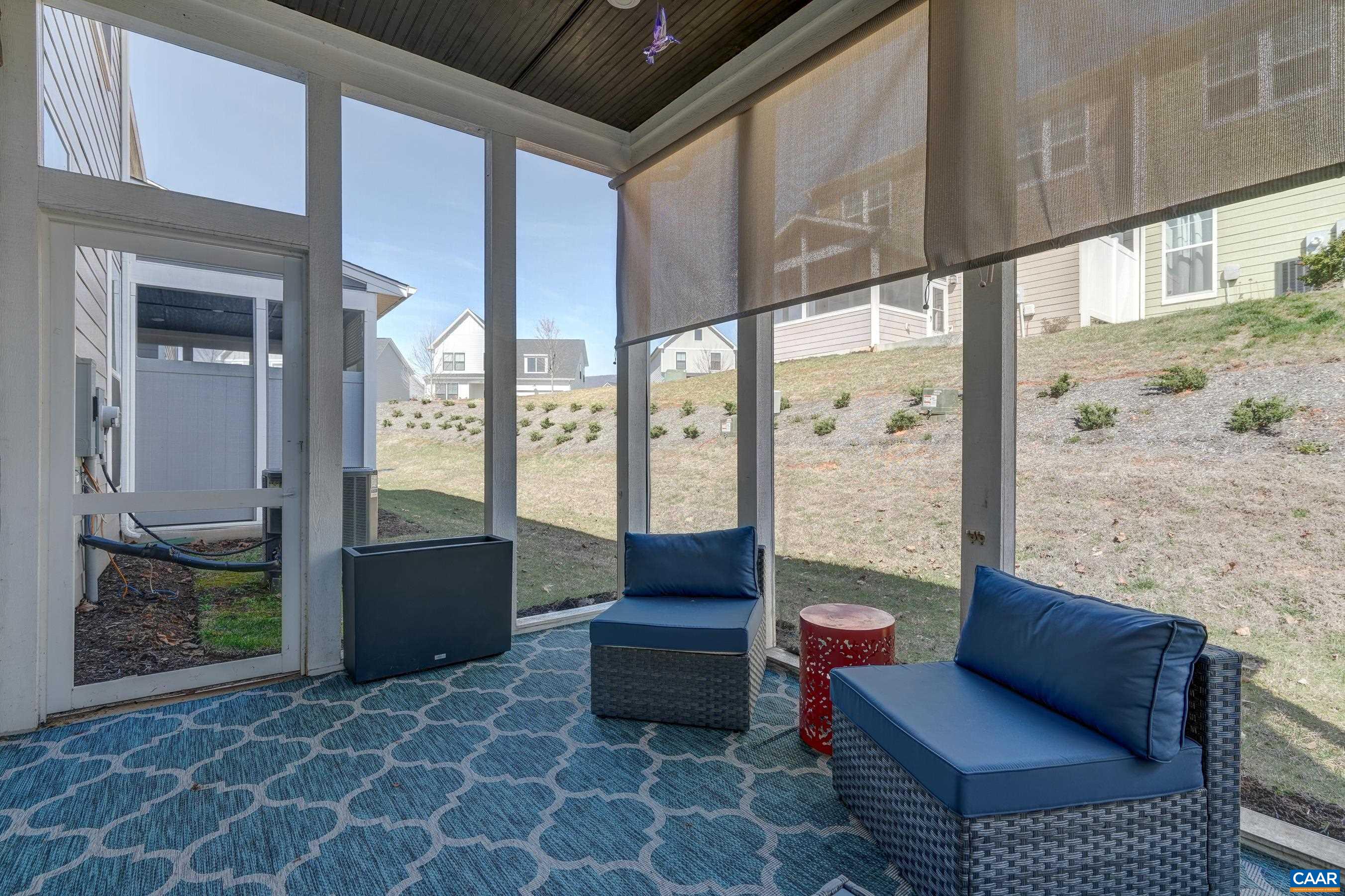 Enjoy summer evenings on the screened porch with sun/privacy shades.