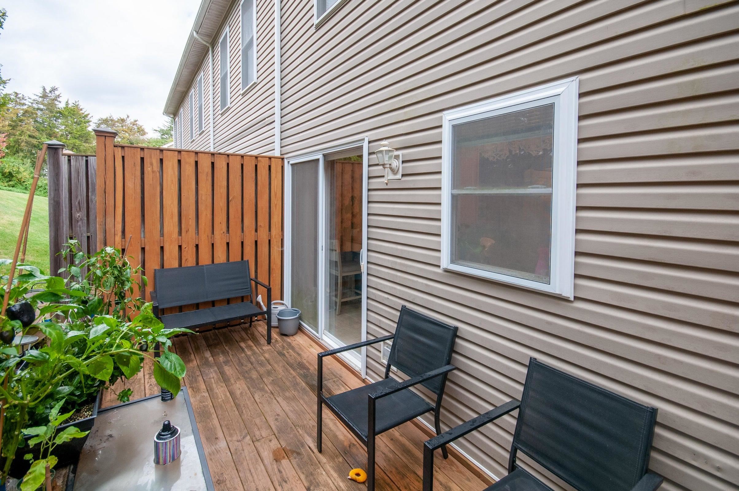 Rear deck with privacy fence.