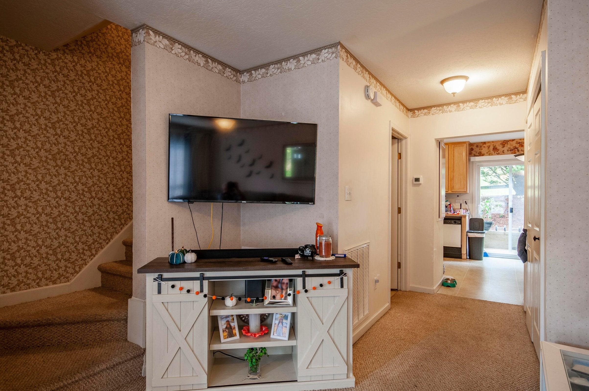 Living room opens into the kitchen.