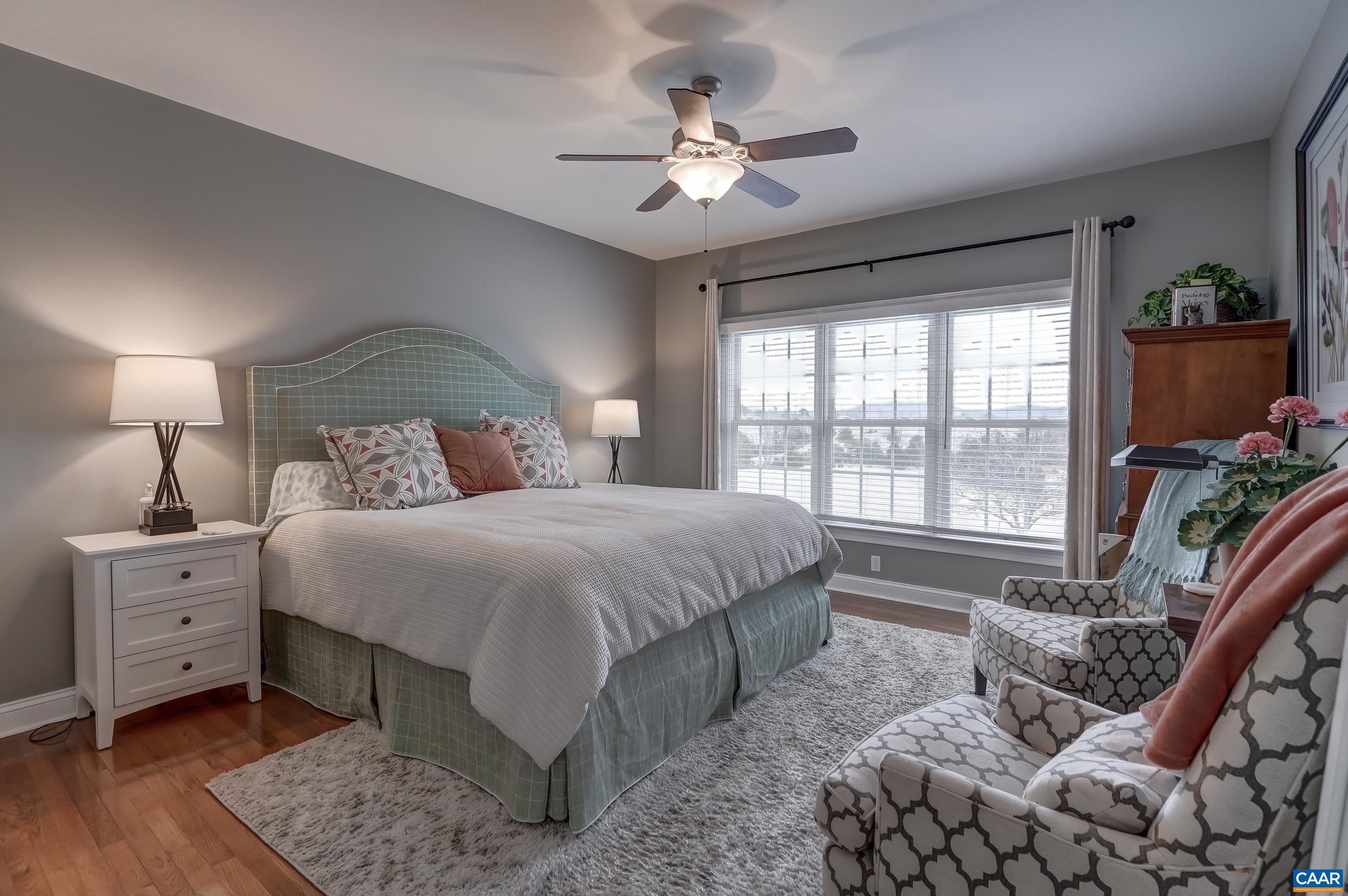 Main level primary suite with two custom closets, and ensuite bathroom. Main level primary suite with two custom closets, and ensuite bathroom.