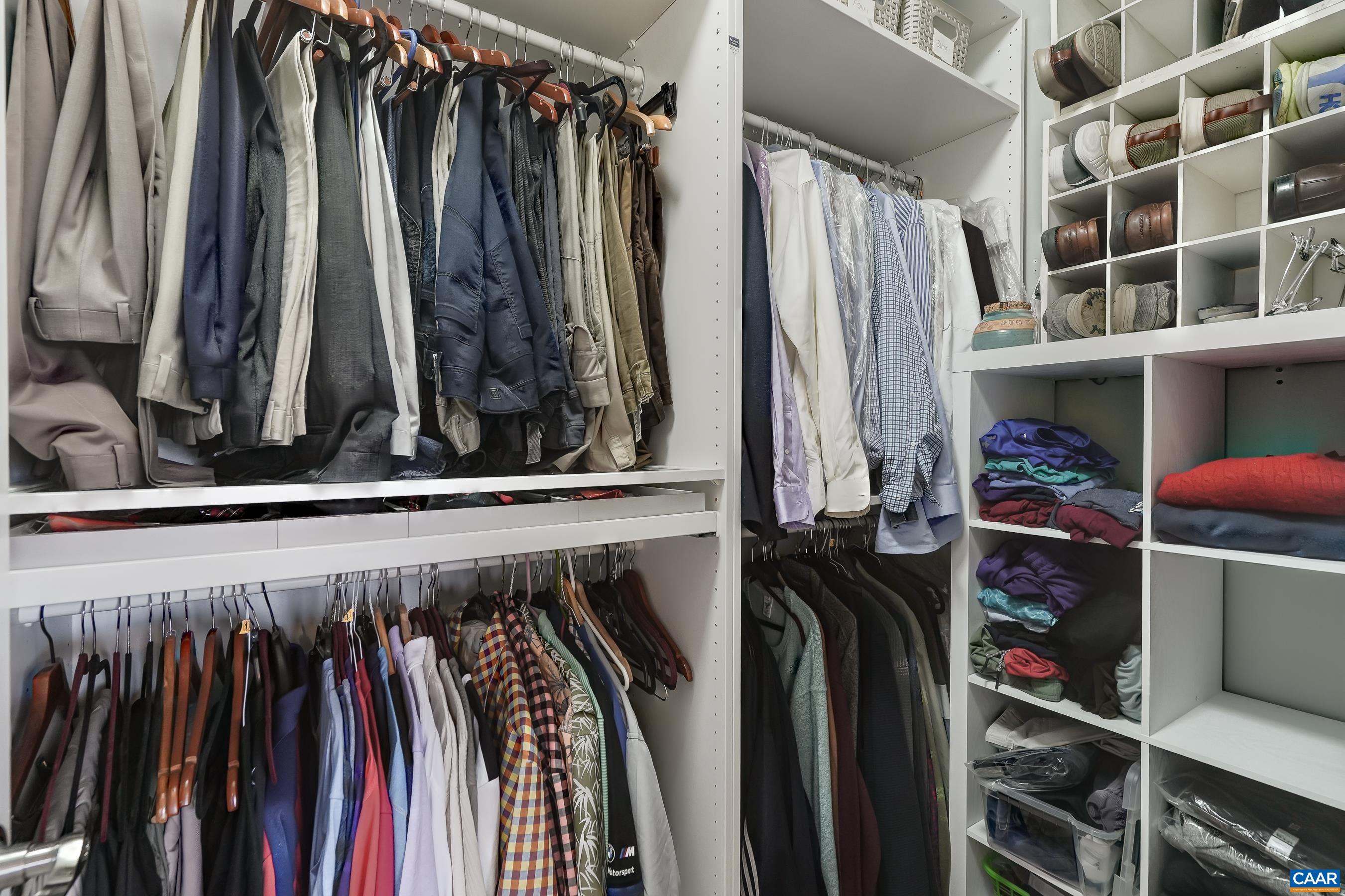 Walk in closet with custom storage. Walk in closet with custom storage.