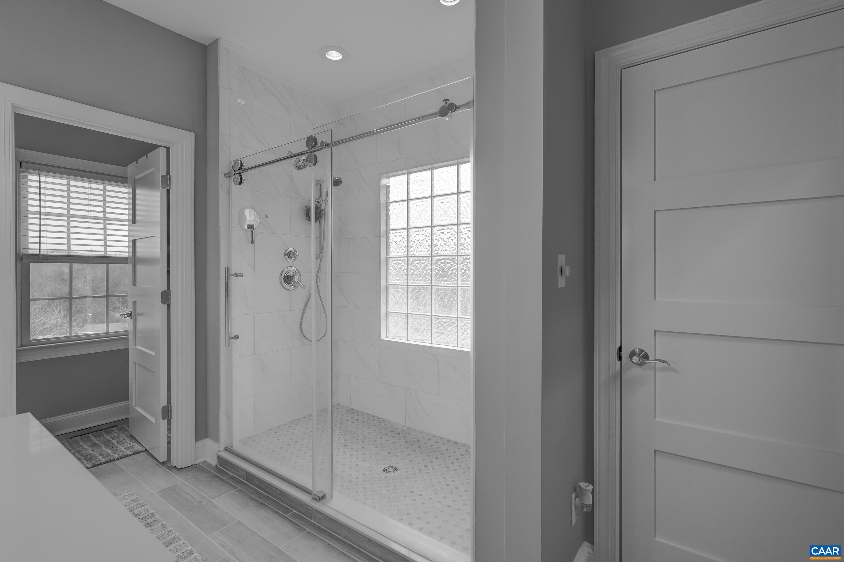 Remodeled bathroom with frameless glass shower. Remodeled bathroom with frameless glass shower.