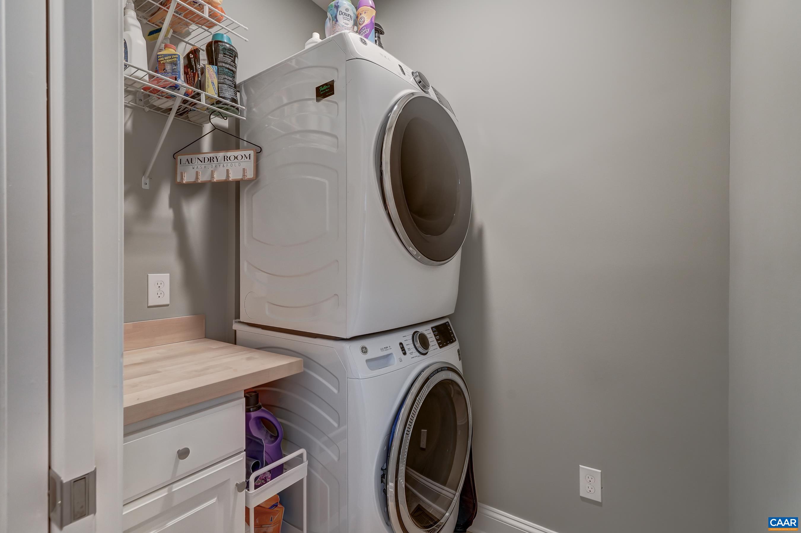 Main level laundry room with stacked washer/dryer hookups. Main level laundry room with stacked washer/dryer hookups.