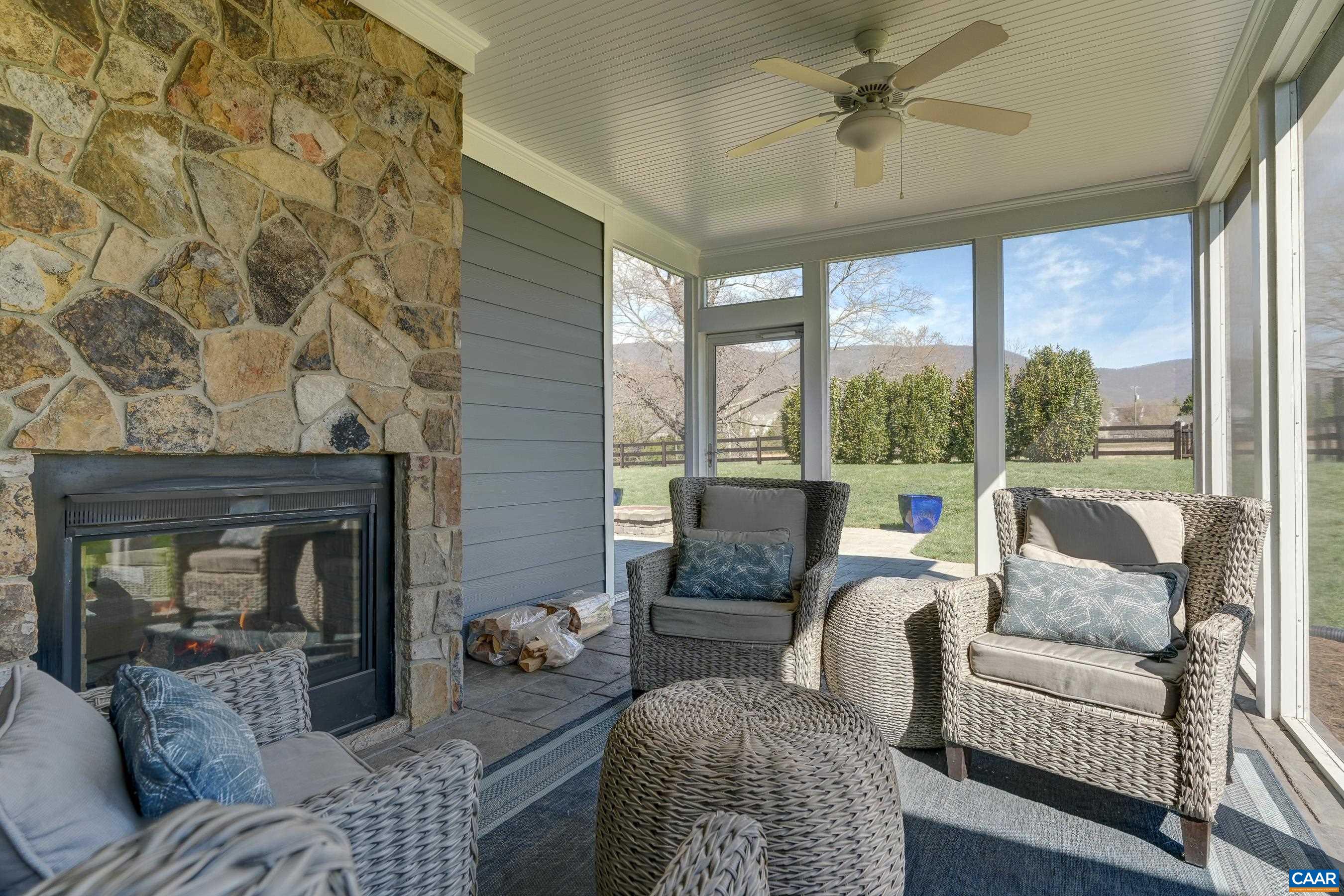Stunning stone fireplace on the screened porch.