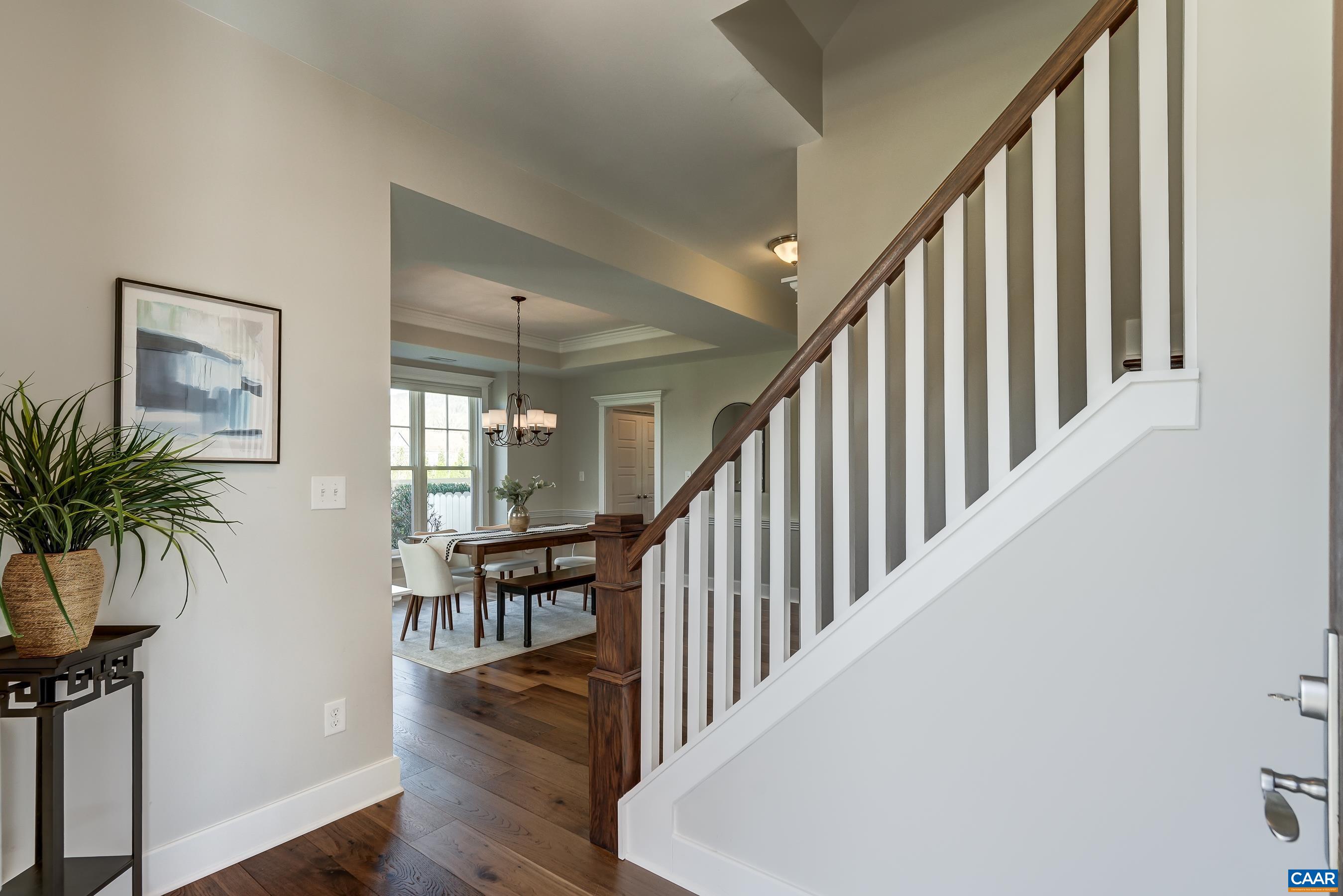 Hardwood floors, fresh paint and floor-to-ceiling windows throughout the main level!