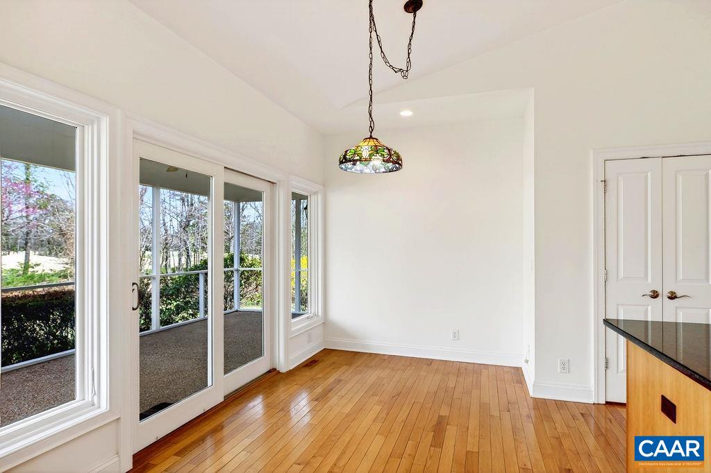 Breakfast nook with direct access to the spacious screened porch.