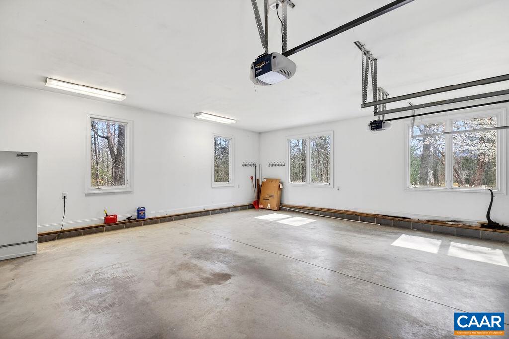 Oversized two-car garage with built-in storage closets.