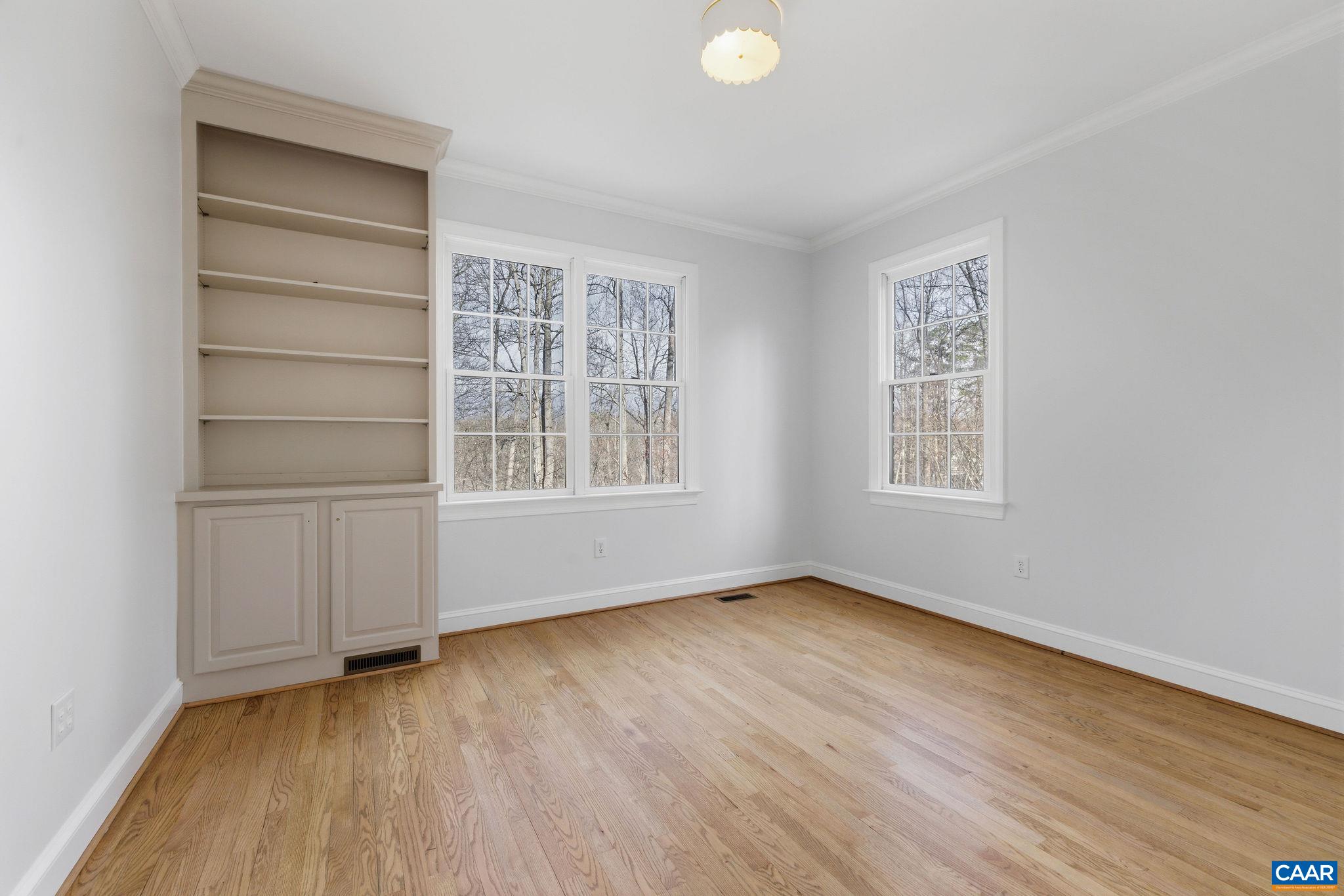 Main level flex room/bedroom with attached access to full bath.