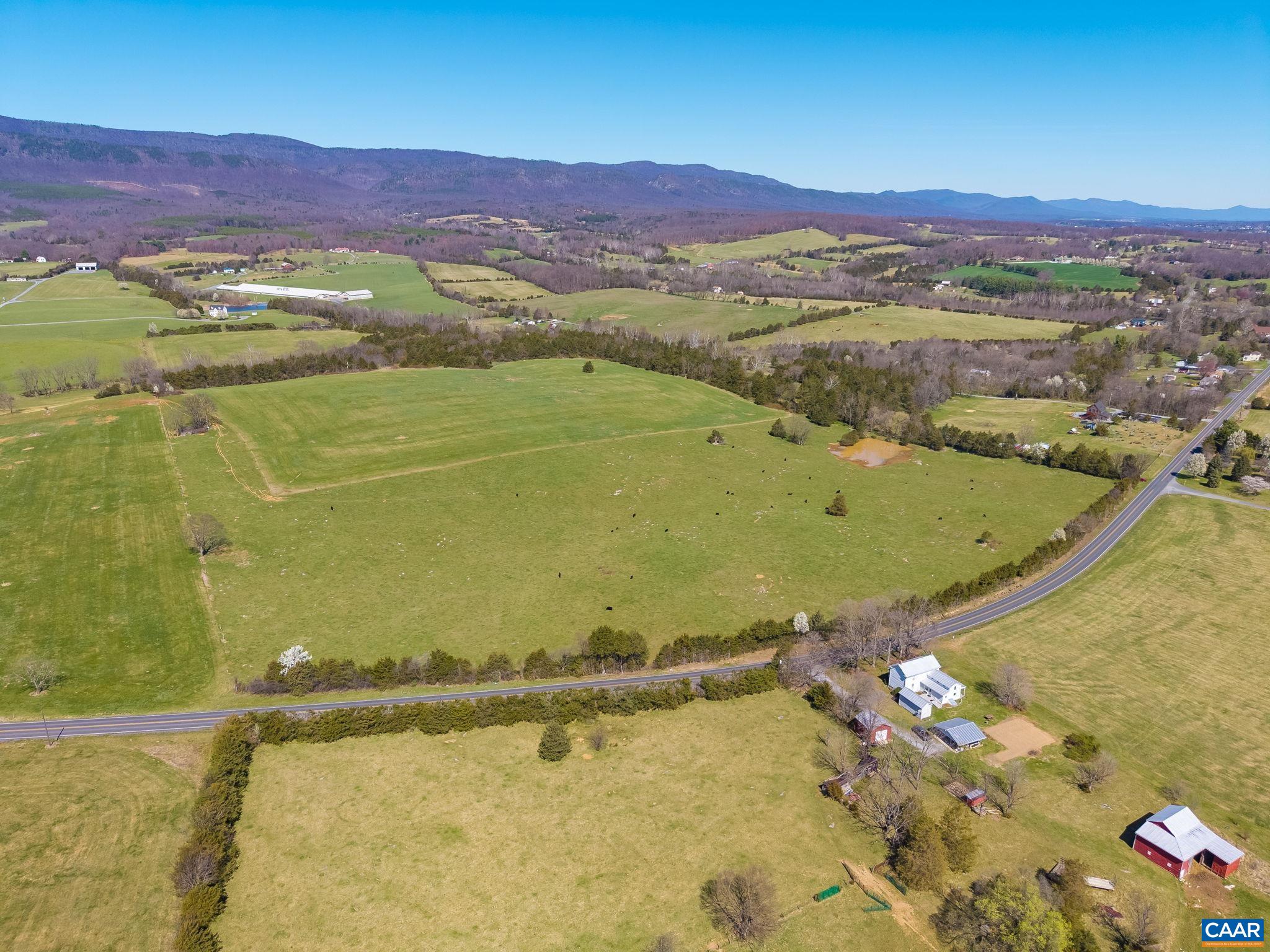 East Point Road frontage looking due north.  In view is the grazing pasture, with hay pasture just beyond.