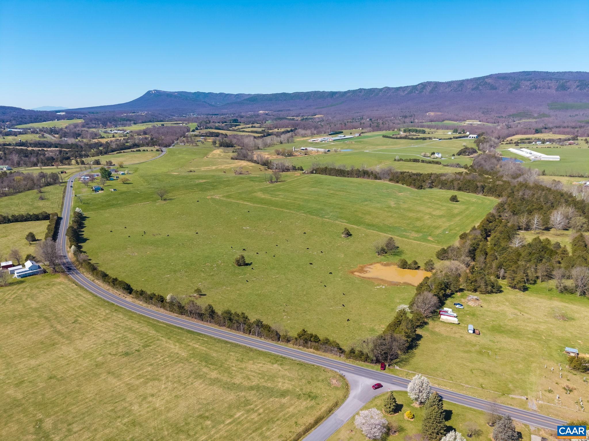 The tree line along East Point Road is in view, with Massanutten mountain in the distance.