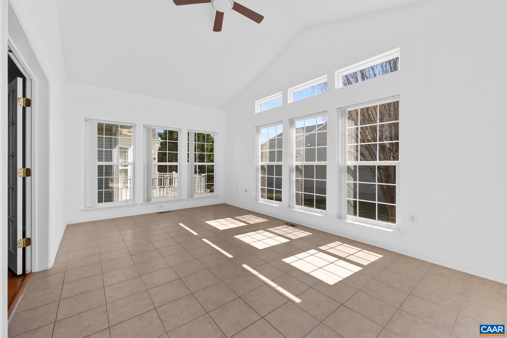 Cathedral ceiling and door to the deck Cathedral ceiling and door to the deck