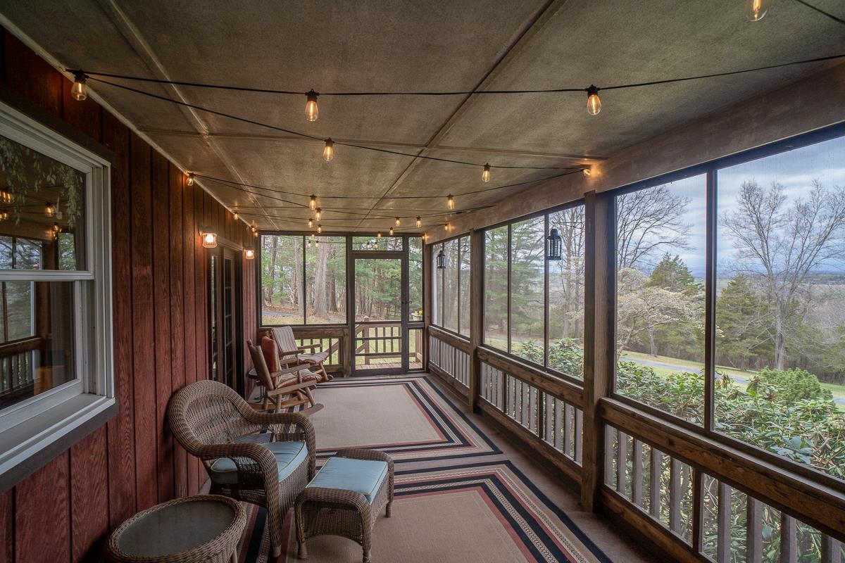 Charming screened porch with twinkling lights.
