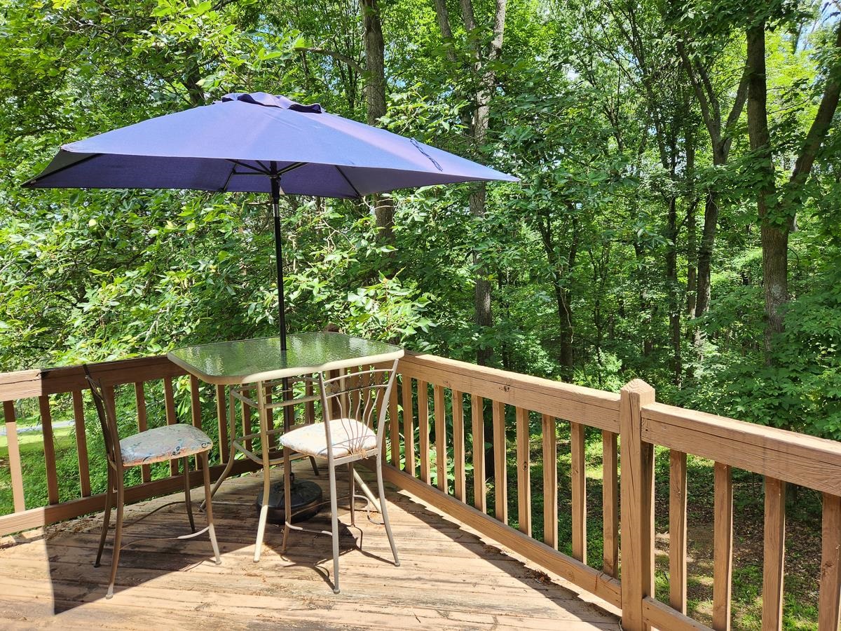 Serene deck retreat in nature's embrace.