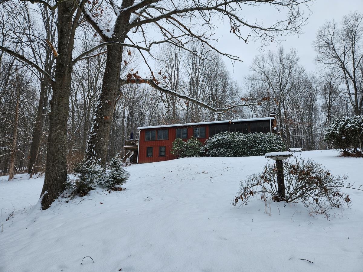 Charming home nestled in winter's embrace.