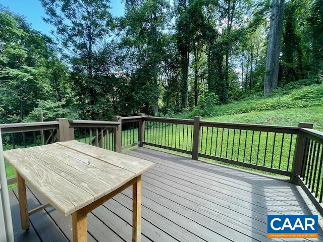 Side deck is the perfect spot for a grill and dining outdoors with immediate access to kitchen