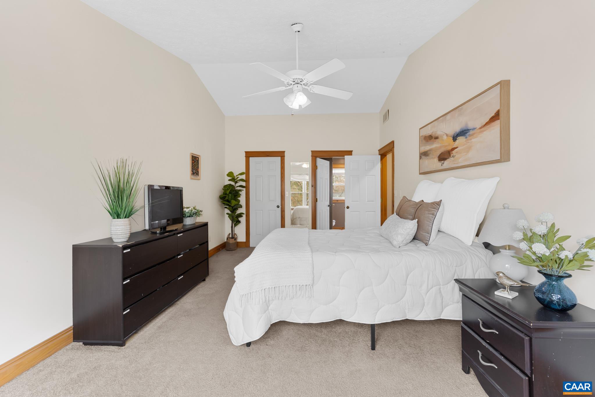 Spacious 2nd-floor primary bedroom with vaulted/cathedral ceilings and an attached primary bath. Spacious 2nd-floor primary bedroom with vaulted/cathedral ceilings and an attached primary bath.