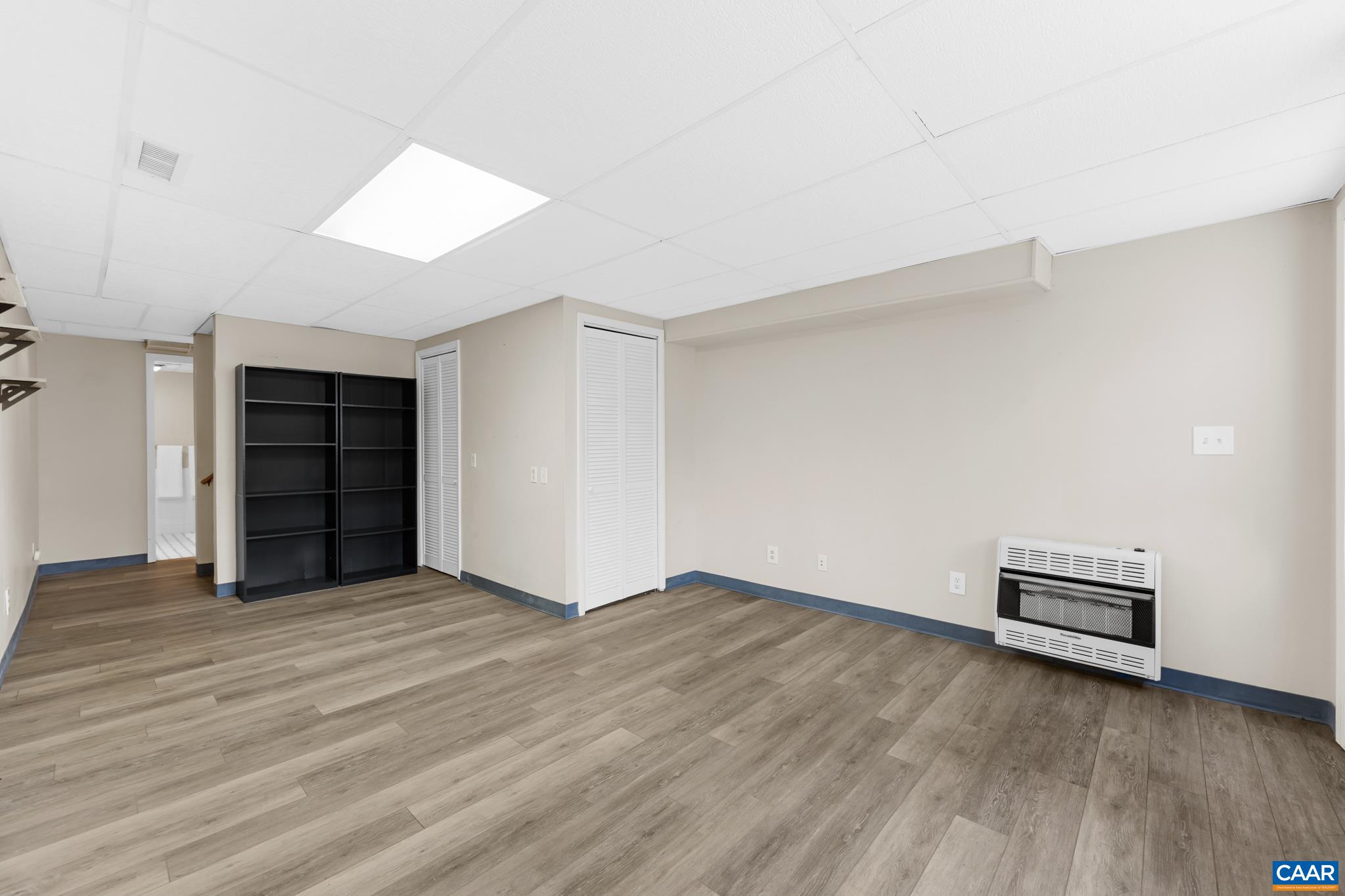 Finished walk-out basement featuring a large recreation room, full bath, and additional storage. Finished walk-out basement featuring a large recreation room, full bath, and additional storage.