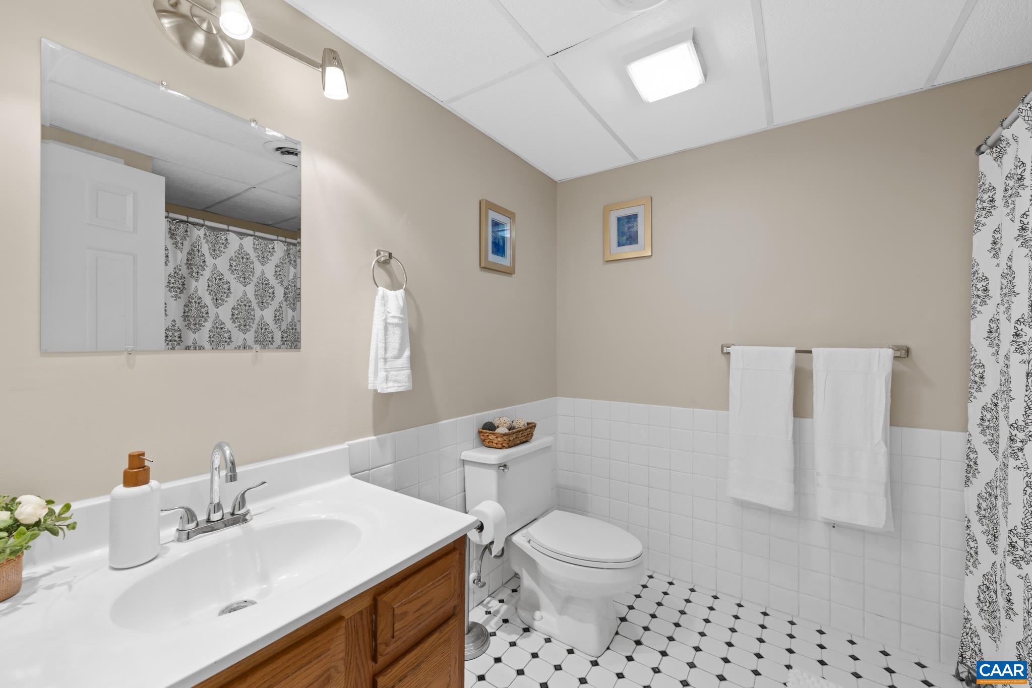 Convenient full bathroom located in the finished walk-out basement near the recreation room Convenient full bathroom located in the finished walk-out basement near the recreation room