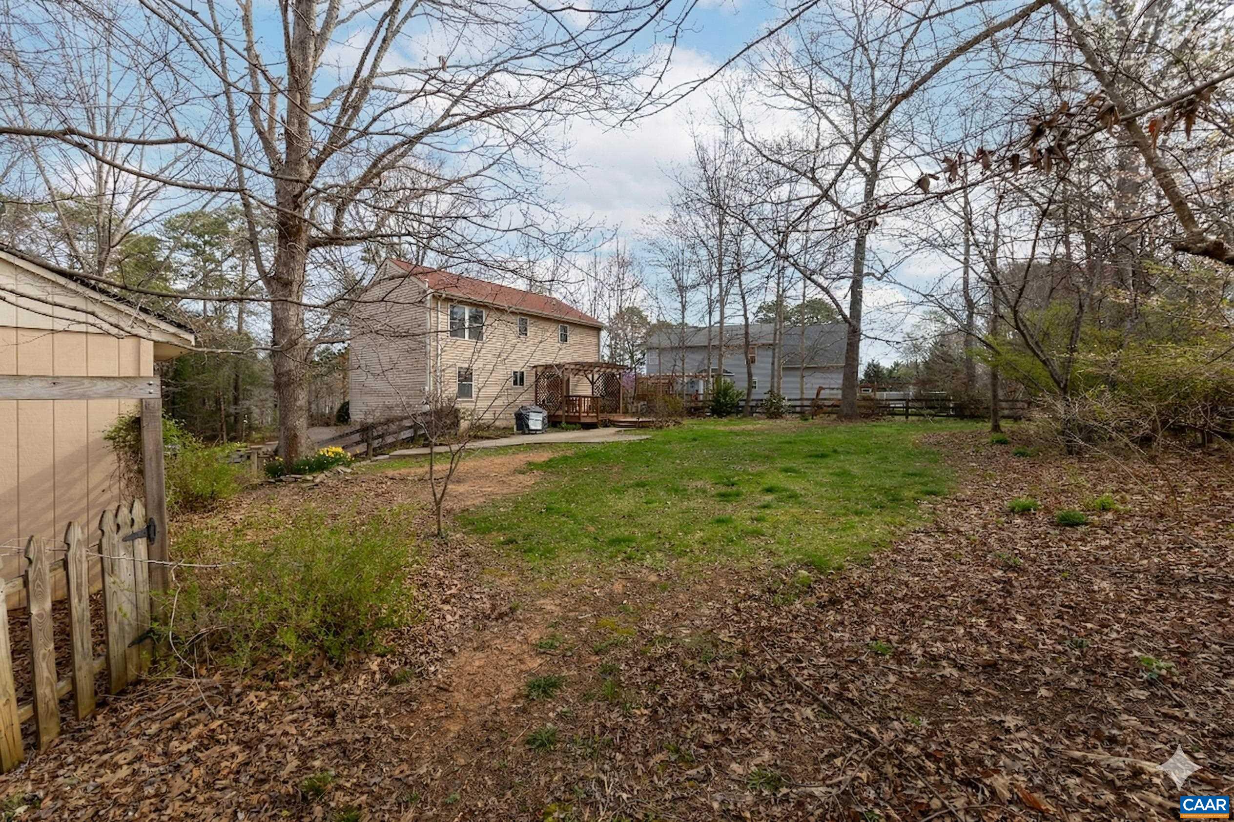 Large, fully fenced backyard in Lake Monticello, Palmyra, VA, featuring a storage shed and mature trees Large, fully fenced backyard in Lake Monticello, Palmyra, VA, featuring a storage shed and mature trees