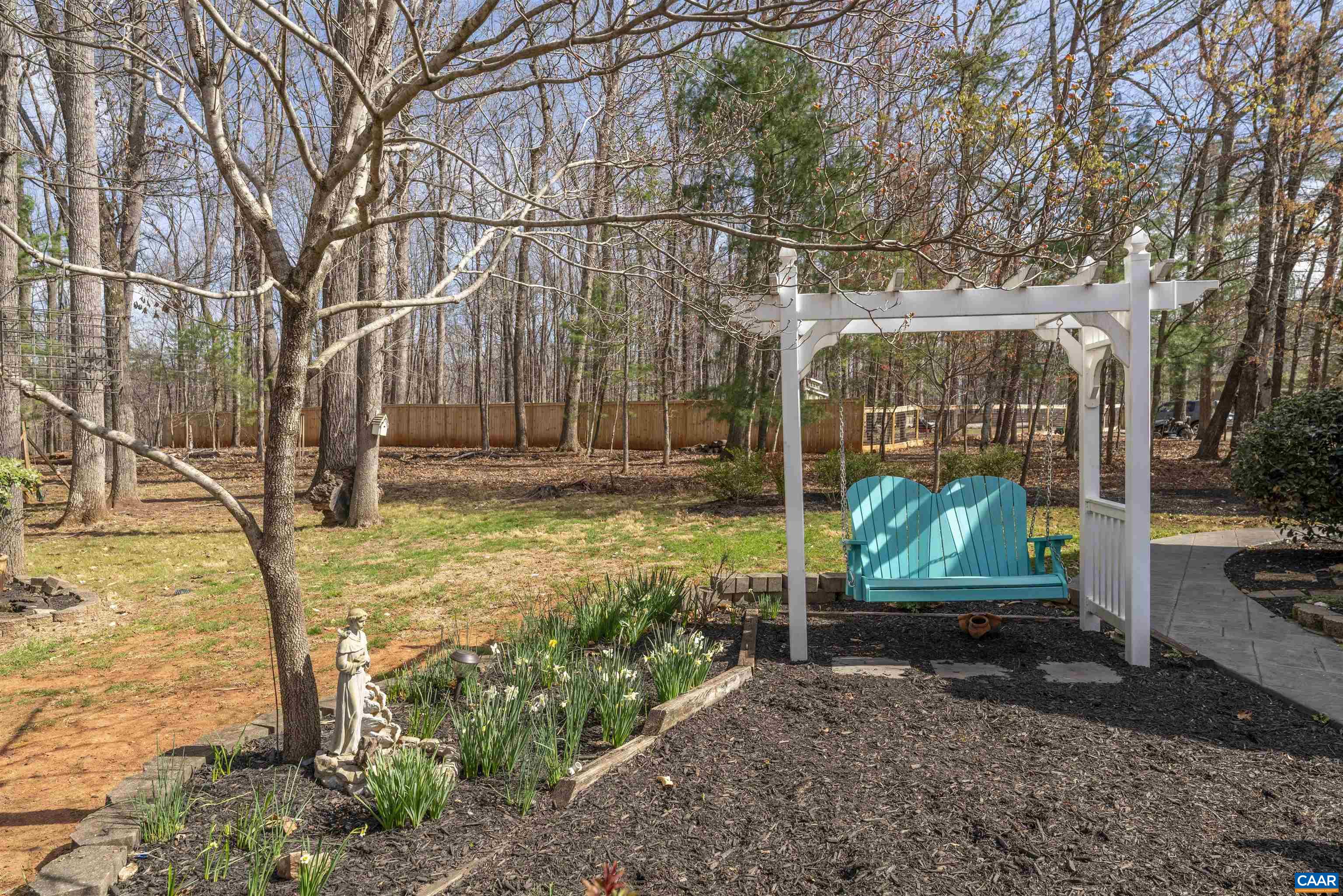 Rear yard view with love seat swing! Rear yard view with love seat swing!