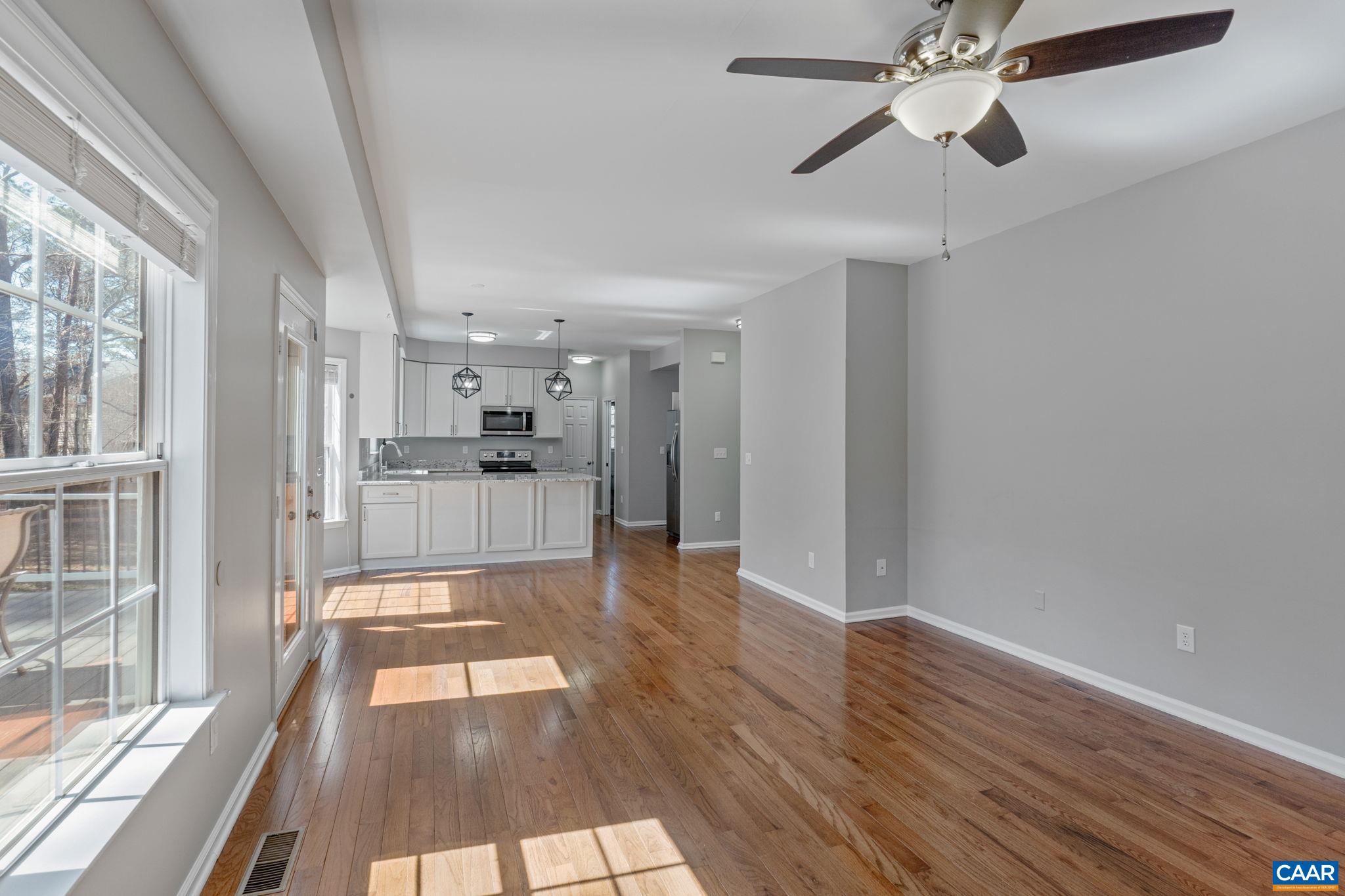 Living room is open to the eat-in kitchen and steps out onto the large rear deck - a wonderful set-up for entertaining.