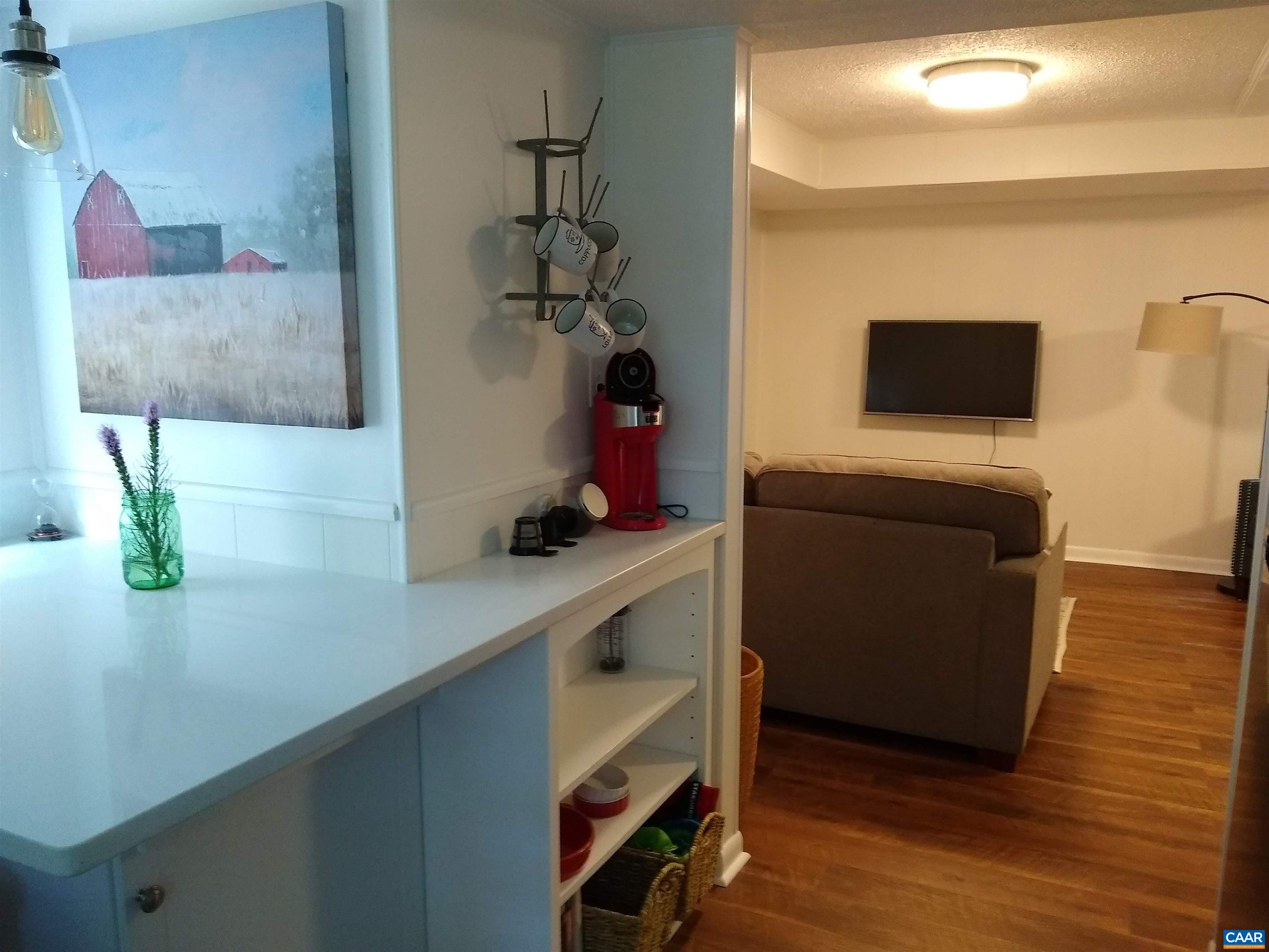 Kitchen leads to the living room.